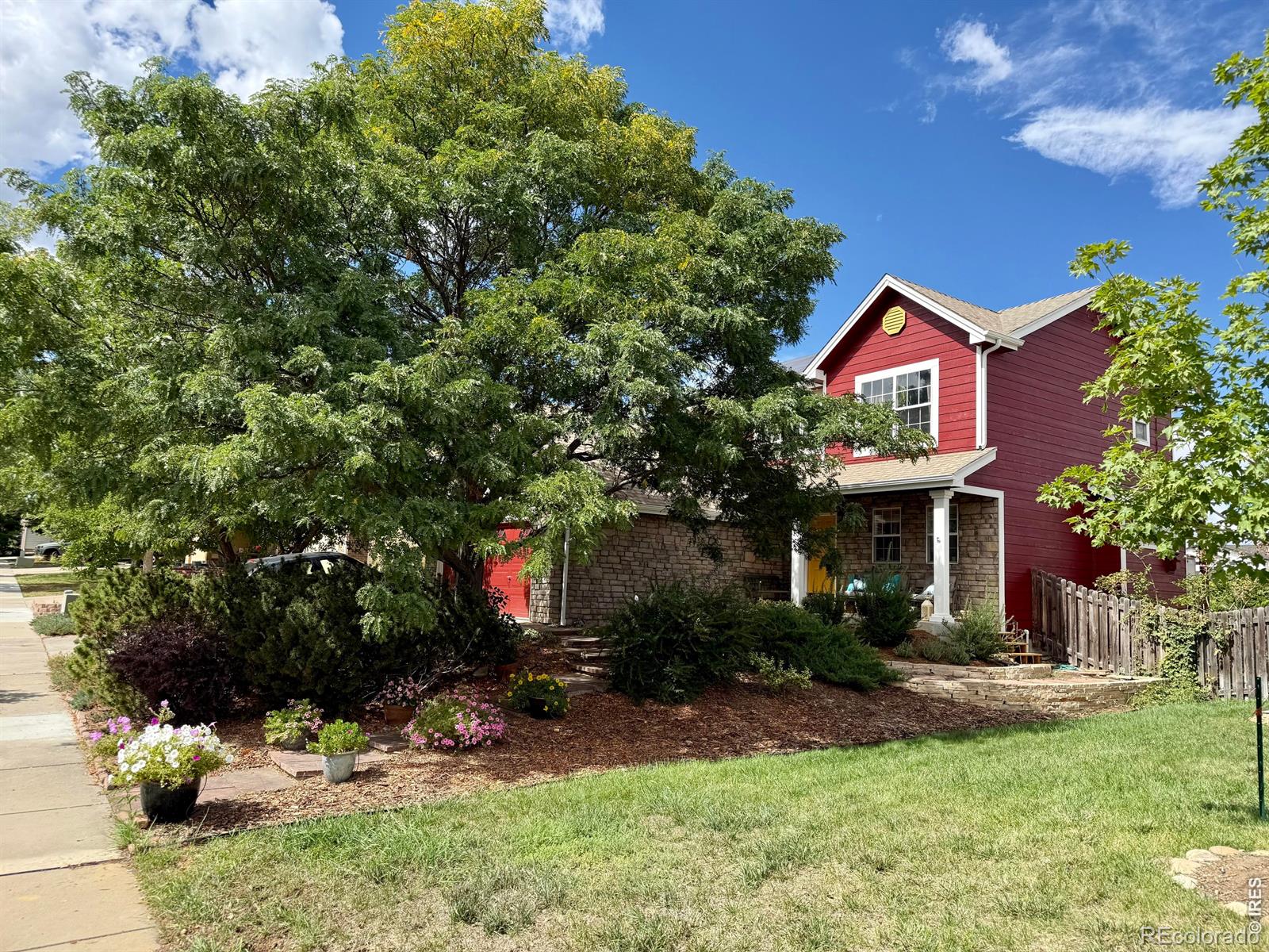 Welcome home to this beautifully updated, well-loved residence at 518 Arbor Dr, where thoughtful design meets exceptional energy efficiency. Large windows and fresh interior/exterior paint create a sunny and welcoming atmosphere from the moment you arrive at this turn-key property. The cozy porch surveys a xeriscaped frontyard oasis, including mature shade trees. The private backyard sanctuary features stunning custom flagstone paths, stone accent walls, a large and relaxing covered patio, and a raised garden overlooking quiet open space and views of Longs Peak. Upstairs, the expansive 400 sqft balcony deck is a grand space for enjoying your morning coffee or hosting an outdoor dinner party. Inside, the vaulted entryway immediately welcomes you into the wide-open living space, highlighted by a heartwarming fireplace, relaxing backyard views, and a natural-wood staircase. Seamless ambient music is possible via robust built-in speaker wiring throughout. The home features 4 bedrooms, 4 baths, and generous organized storage. High-performance, eco-friendly infrastructure protects you from fuel-cost uncertainty. The 4.5 kW rooftop solar array offsets nearly all home energy needs, paired with new, whisper-quiet whole-house heat pump for year-round comfort. Additional green features include a new heat-pump water heater and 240V Level-2 EV charging infrastructure in the garage. Perfectly situated for effortless access to Boulder, Longmont, Broomfield, and the I-25 corridor. A short walk easily leads to Lafayette's Public Library, open-space trails, the Lafayette Rec Center, VASA Fitness, and Old Town Lafayette local coffee shops, craft breweries, and dining. Enjoy vibrant community events like the Sunday Farmers Market, Art Night Out, and the Picnic on the Plaza live-music series. This is a super safe, walking neighborhood with no thru traffic. Come visit today and make this cozy, future-proof haven your own!