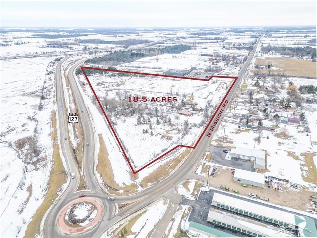 LOCATION, LOCATION, LOCATION on MISSION! 18.5 acres of Commercial Property zoned C-1 with water, septic, gas, and electricity. 2 buildings/ Pole Barns are included as well as the seller is open to splits that are available for any of your building needs. Just south of Downtown Clare with the on ramp to US127 on the back end, roundabout, and Mission Rd on the other. Thousands of cars pass this location throughout the day! Property is visible from every angle to show off your new business. Property is cleared and ready for your ideas. The south side of the property used to be a driving range and is drained for a rebuild or any other businesses. Over 1200 ft of road frontage and 1600 ft of US127 exposure, this is a very RARE and once in a lifetime opportunity! Convenient access to Clare, Midland, Mount Pleasant, US 127, US10, shops, golf courses, restaurants, businesses, and much more! Come check this property out before its gone!