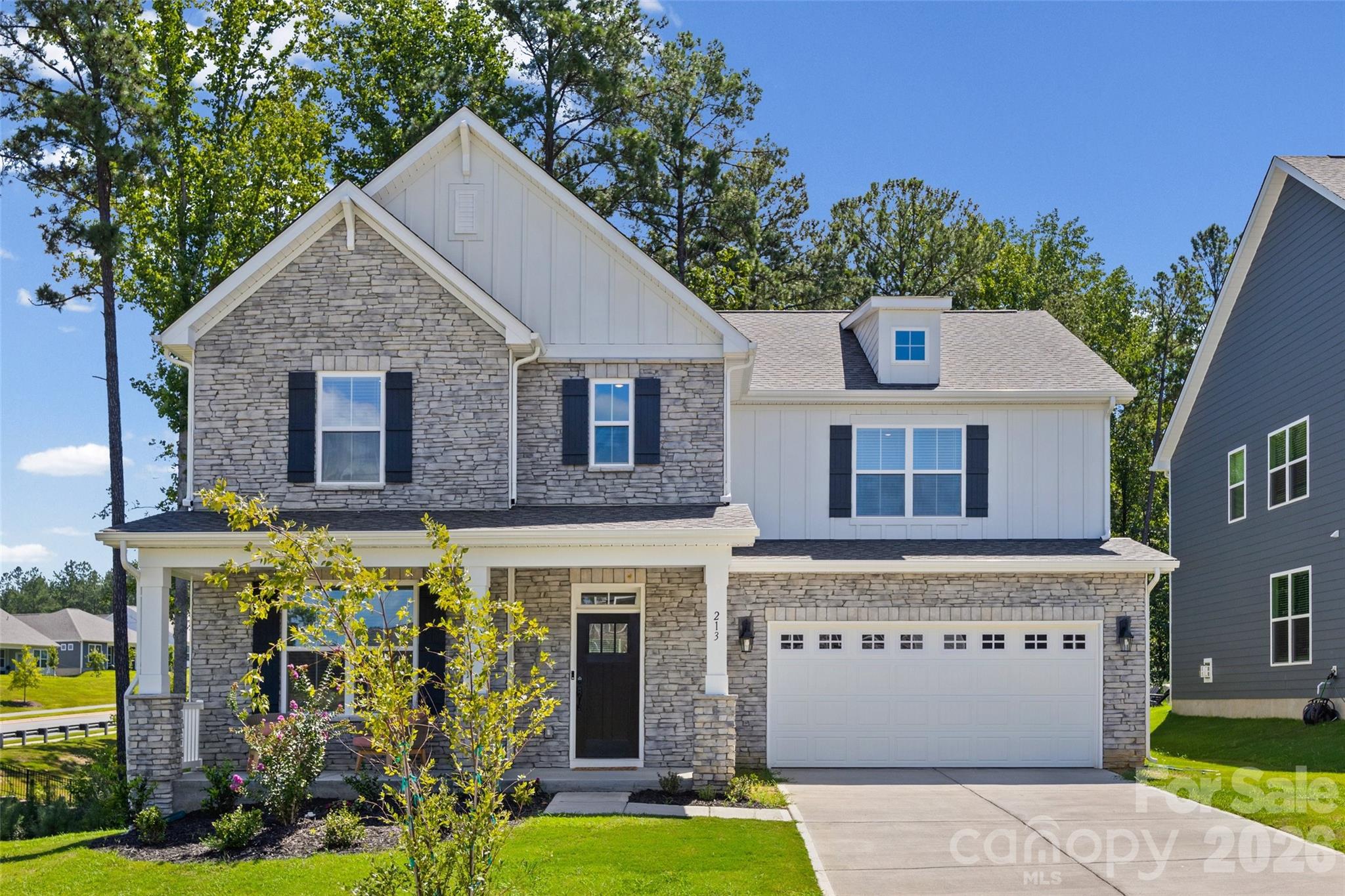 Welcome to this pristine, barely lived-in 4-bedroom, 3-bathroom home featuring the popular Jordan plan in the desirable Westport subdivision! Designed for effortless modern living, the main level boasts an inviting foyer, a seamless open-concept floorplan, a versatile flex room ideal for a home office, and a main-floor bedroom with a full bath providing the option for first floor living. The main area seamlessly transitions into an impressive kitchen, where preparing meals and entertaining feel natural around a large central island with a breakfast bar, complemented by stainless steel appliances and a generous walk-in pantry. Upstairs, the large primary suite offers a peaceful sanctuary, complete with a spacious walk-in closet and en-suite featuring dual vanities, a garden tub, and a separate shower. Two additional bright bedrooms share a full secondary bath, completing a turnkey home that delivers all the perks of new construction without the wait!