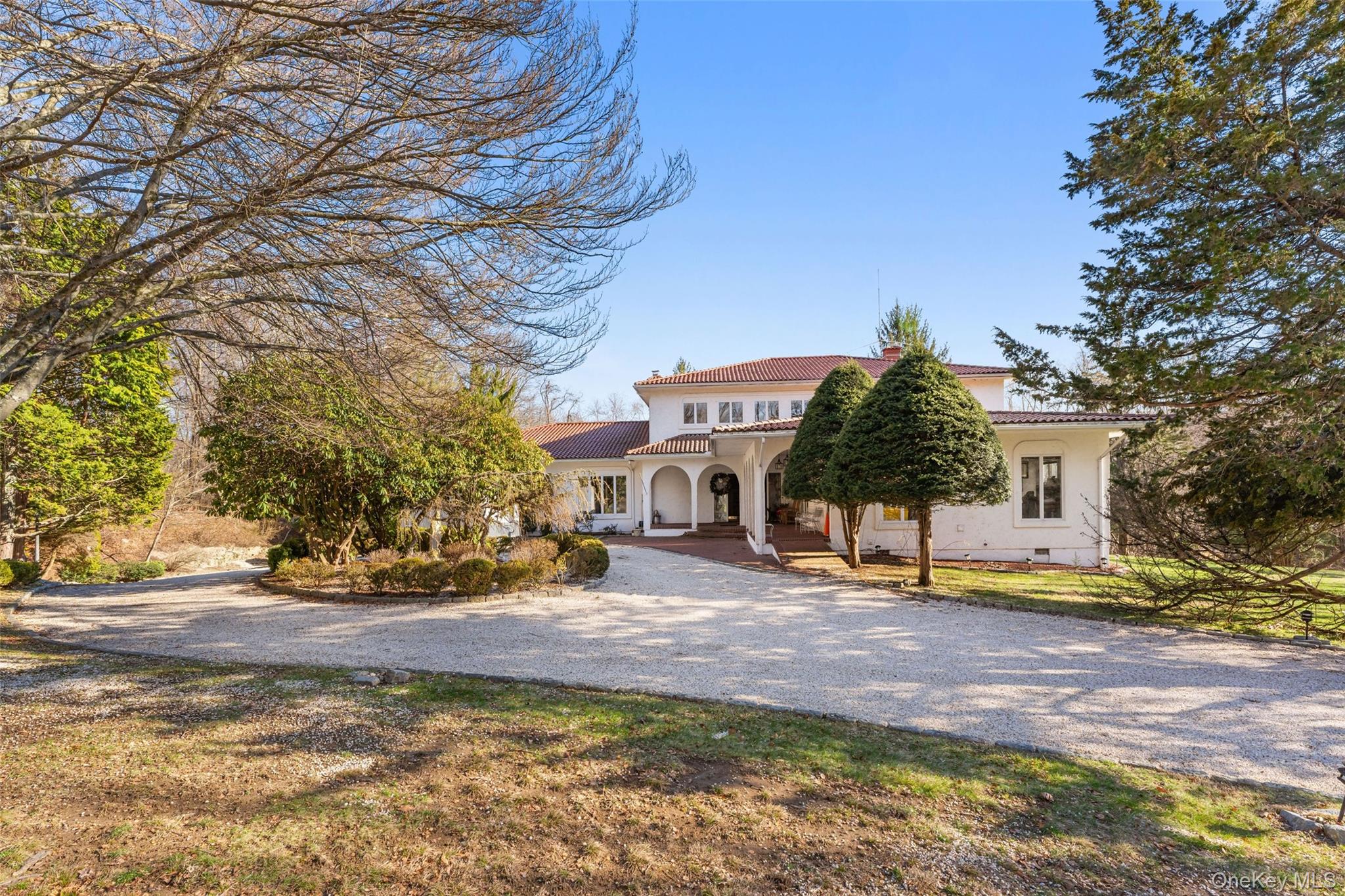 Step into a slice of Mediterranean paradise at 105 Cross Pond Road, where timeless elegance meets modern luxury. This breathtaking villa, inspired by classic European architecture, boasts over 6,000 square feet of refined living space on 5.+ meticulously landscaped acres. From the iconic red clay roof to the graceful stucco and stately arches, this property exudes sophistication at every turn.Key Features That Will Steal Your Heart:Mediterranean Charm: The distinctive architectural elements create an enchanting, old-world aesthetic.Expansive Interiors: Multiple fireplaces, private terraces, and oversized balconies invite seamless indoor-outdoor living.Private Waterfront Oasis: Your very own lagoon offers tranquil views, waterside relaxation, and kayaking adventures just steps away.Luxurious Finishes Throughout: Marble and natural stone details bring warmth and elegance to every room.Nature’s Playground: Over 5+ acres of pristine grounds, complete with a private island, provide endless opportunities for outdoor entertaining and peaceful solitude.Inside the Villa: From the moment you enter, the grand scale and thoughtful design captivate. Open-concept spaces flow effortlessly, perfect for everything from quiet evenings to hosting grand gatherings. Marble and stone finishes elevate the interiors, while fireplaces add cozy charm. Step outside onto expansive terraces and balconies to savor al fresco dining or watch the sunset over your serene property. The home also offers flexible spaces ideal for a chef’s kitchen, wine room, home gym, or a luxurious primary suite.Unbeatable Location for a Coveted Lifestyle: Nestled on prestigious Cross Pond Road in Pound Ridge, this estate combines privacy with accessibility. It’s part of the highly regarded Bedford Central School District and offers convenient access to I-684, Saw Mill Parkway, and Metro-North stations for an effortless commute to Manhattan. Nature lovers will adore the proximity to Ward Pound Ridge Reservation for hiking, camping, and fishing, while the charming nearby towns of Katonah, Bedford, and Stamford, CT, provide boutique shopping, fine dining, and cultural experiences. For wine enthusiasts, local vineyards and specialty shops await to help you curate the perfect collection.A Once-in-a-Lifetime Opportunity: 105 Cross Pond Road isn’t just a home—it’s an experience. Whether you’re savoring lakeside mornings, hosting elegant, or simply enjoying the serene beauty of your surroundings, this estate offers a lifestyle of unparalleled luxury and tranquility. Don’t miss your chance to make this extraordinary retreat your own.