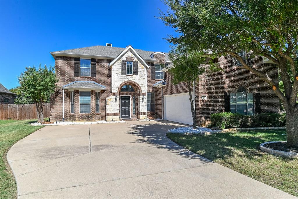 This fantastic home with soaring ceilings and an open floorplan is a MUST SEE! The home greets you with beautiful hardwood floors and plenty of space for family and entertaining. The living room is oversized with fireplace and tall ceilings and looks into the heart of the home, the kitchen. The kitchen features granite countertops, stainless appliances including a gas cooktop, electric oven, dishwasher, and microwave, and cabinets galore! The pantry is large and the kitchen has tons of storage. The kitchen has easy access to both the dining and breakfast rooms making entertaining easy! The primary bedroom is downstairs and has an ensuite bath with a jetted tub, separate shower, and dual sinks. The walk in closet is amazing and has plenty of room for everything! The study can double as a den or additional bedroom and is separate from the primary and main living for added privacy for work from home. The backyard has a covered patio with an extended deck! Upstairs features a large game room with attached media room for movies and games. Three additional bedrooms have large closets and plenty of space! Two full baths up! This home is close to major transportation routes, world class dining and shopping, and feeds to award winning Keller ISD including Keller High School. Don't miss this great home!