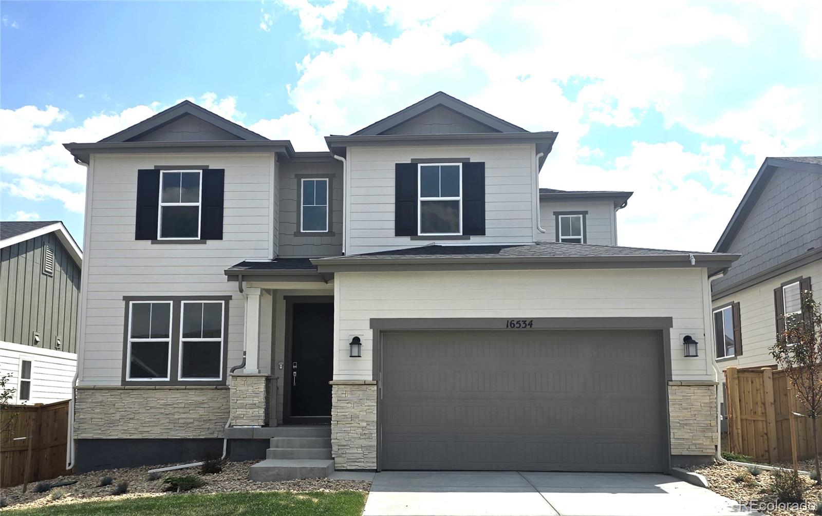 What's Special:  High Ceilings | Oversized Patio | White Cabinets.New Construction – Ready Now! Built by America's Most Trusted Homebuilder. Welcome to the Silverthorne at 16534 W 93rd Way in Trailstone. The Silverthorne floor plan brings flexibility and comfort to everyday living. The kitchen features a walk-in pantry and eat-in island, opening to the dining area and great room for easy flow. A morning room off the kitchen adds a sunny spot to start your day. Upstairs, the primary suite includes a 4-piece bath and walk-in closet, with three more bedrooms and a laundry room nearby. The unfinished basement offers space for storage, a home gym, or future expansion. Trailstone is a new community in Arvada, CO, just off Candelas Parkway and about 15 miles from Boulder. Homes here offer spacious backyards and incredible views of Standley Lake, Downtown Denver, and the Rocky Mountains. Planned amenities include an outdoor pool and pickleball courts, giving you plenty of ways to enjoy the outdoors and connect with neighbors. Additional Highlights Include: fireplace at great room, air conditioning, 8' doors on main level, covered outdoor living with gas line rough-in for future grill, additional sink at secondary bath, plumbing rough-in at basement, utility sink rough-in at laundry, craftsman railing and spindle at stairs. MLS#9182167