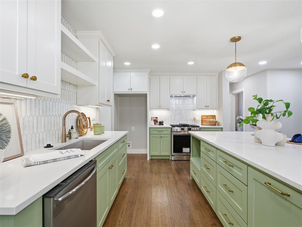 A complete designer transformation awaits at this beautifully remodeled 4-bedroom, 2-bath Fort Worth home, offering an open living and kitchen concept, a private primary retreat, and super easy and quick access to Downtown Fort Worth! Fresh landscaping, a painted white exterior, natural wood accents, and an inviting covered front porch create standout curb appeal. Inside, the open-concept living, dining, and kitchen areas are filled with natural light. Refinished hardwood floors, recessed lighting, crown molding, designer fixtures, and a timeless neutral palette carry throughout the home. The redesigned kitchen features soft sage cabinetry, white countertops, brass hardware, stainless-steel appliances, under-cabinet lighting, a full-height tile backsplash, center island, and an all-gas range. The private primary suite includes a large, spacious closet and a spa-inspired bathroom with dual vanities, extensive built-in cabinetry, brass fixtures, and a spa-style shower. Three additional bedrooms and one remodeled full bathroom provide flexibility for guests, a home office, or a variety of living arrangements. Additional highlights include a dedicated laundry room and thoughtfully selected finishes throughout. Outside, enjoy a fully fenced backyard with a deck, an extended driveway offering ample parking, and a full two-car detached garage. Move-in ready and designed for modern living, this thoughtfully renovated home offers an exceptional combination of style, space, privacy, and everyday functionality. Come make this yours before someone else does!