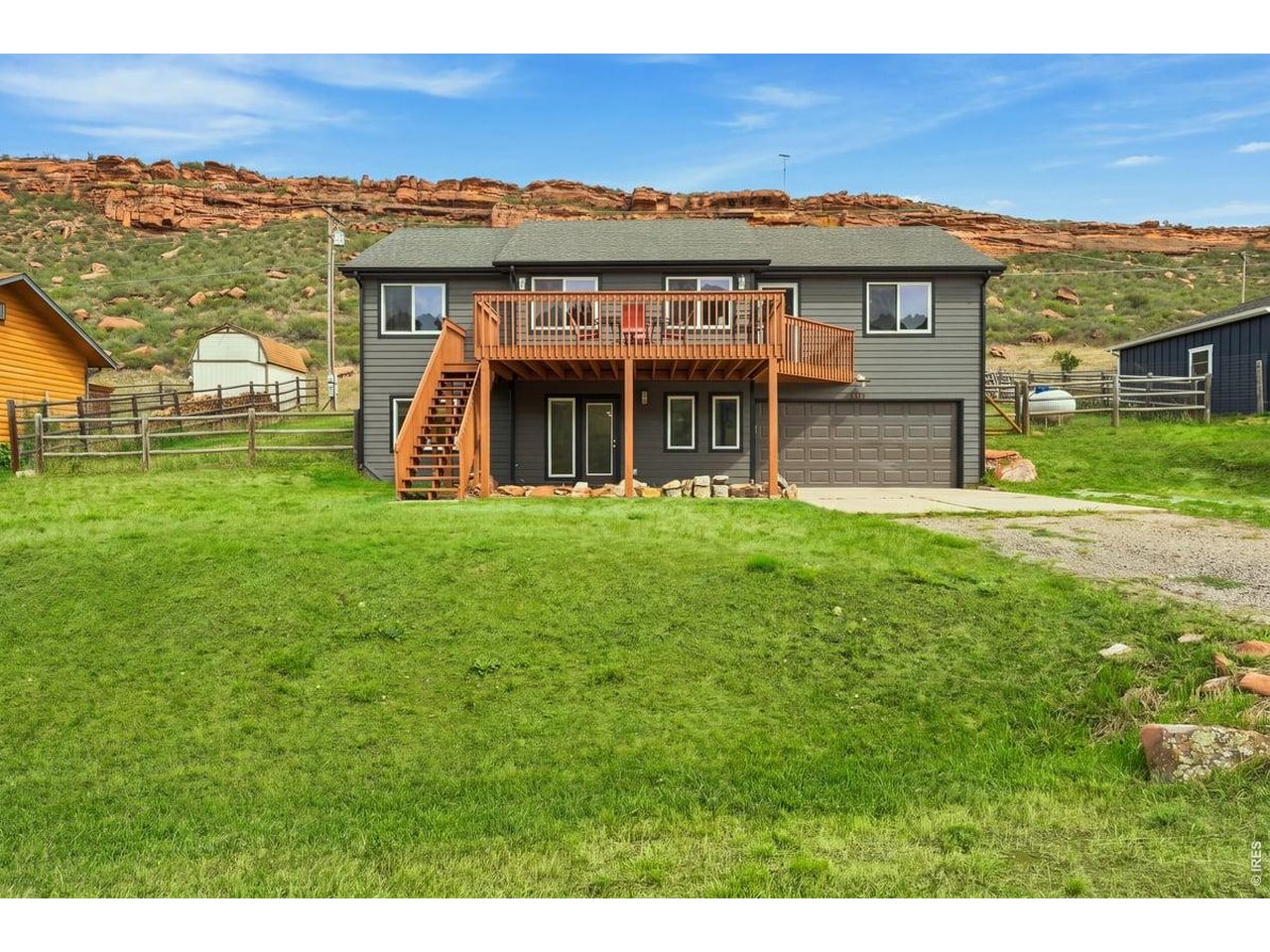 Colorado foothills living with private reservoir access and trails right outside your door! Tucked into the foothills just west of Fort Collins, this beautifully updated 4-bedroom, 3-bath home offers sweeping views across the valley toward Horsetooth Mountain Open Space and Lory State Park-along with private neighborhood access to Horsetooth Reservoir and direct access to miles of hiking and biking trails connecting you to Horsetooth Mountain and Lory State Park. Inside, soaring vaulted ceilings and abundant natural light showcase the views, while hardwood floors throughout the main level, fresh paint, new light fixtures and a remodeled kitchen give the home a fresh, updated feel. The primary suite features a private bath and walk-in closet, and the flexible lower level is already plumbed for an additional kitchenette-opening up possibilities for guests, multi-generational living or an additional entertaining space. The outdoor spaces may be the best part. Start your morning or end your day on the expansive front deck overlooking the valley and surrounding foothills, with a front-row seat to spectacular Colorado sunsets. Out back, a private fenced yard, patio and hot tub sit against a dramatic red-rock hogback backdrop, creating a completely different-and wonderfully secluded-outdoor experience. There's even room for the doggies to enjoy their own piece of the foothills. And unlike many foothills properties, you don't have to sacrifice everyday comforts: this home offers forced-air heat, central air conditioning and an attached 2-car garage. Launch a paddleboard or kayak from the neighborhood's private reservoir access, head directly from home onto the trails, or make the short drive into Fort Collins for dinner and shopping. This is the Colorado lifestyle people dream about-views, water, trails, wildlife and red-rock surroundings, with the convenience of Fort Collins just minutes away.
