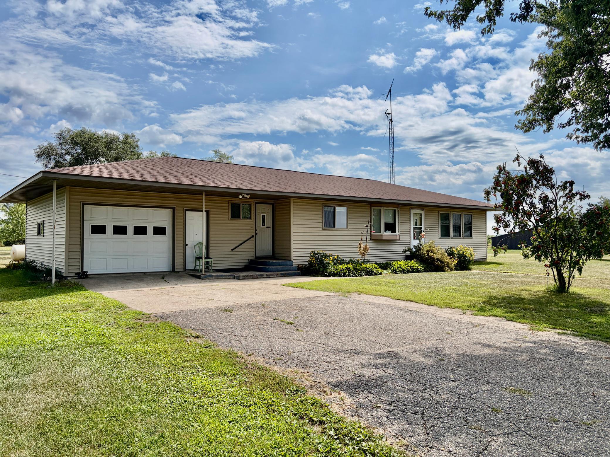 Check out this unique opportunity featuring approximately 17.34 acres of versatile land with a home, 40x80 pole shed, gravel pit, and high-visibility frontage at the intersection of Hwy 71 and Hwy 27, conveniently located between Long Prairie and Sauk Centre.  This well-kept 3-bedroom, 2-bath rambler offers several updates, including a new roof in 2025, vinyl siding and windows in 2010, furnace, custom hickory kitchen cabinets, and more. The spacious layout provides comfortable living space while the acreage offers room to enjoy the outdoors and explore a variety of possibilities. The 40x80 pole shed features 10' sidewalls, a 10'x12' overhead door, 15'x10' sliding door, 220V power, and a 100-amp electrical panel, providing plenty of space for storage, a workshop, equipment, or business operations. This property is well-equipped for a variety of uses.  A gravel pit adds another unique feature and could offer potential for additional income, subject to applicable approvals, or provide an opportunity to create a private recreational area such as a dirt bike track or other outdoor use.  With excellent visibility, convenient access to major highways, acreage, large outbuilding, and a variety of potential uses, this property offers a rare combination of residential, recreational, and business opportunities. Whether you're looking for a place to call home, space for your business, room for equipment and hobbies, or simply acreage with potential, this property is worth a look!