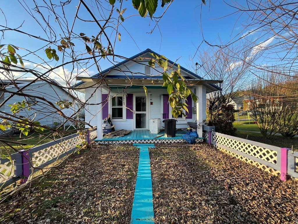 This charming little cottage is located above the New River Trail, with access to the trail only one block away. This is a project house. The exterior of the house is in good condition and has a newer metal roof. There is extensive landscaping all around the property, and in the spring the yard will burst into a riot of colorful blooms. House sits on a good-sized level corner lot. The interior of the home is in overall fair condition; the bathrooms are in good condition but other interior areas of the home have been partially demolished as part of a remodeling project. Most of the interior demolition work has been completed. Building materials in the house will convey with the sale. Original hardwood floors in some rooms. Lovely covered front sitting porch as well as an open deck in the back. Off street parking in yard/on street allowed. Houses down by the river and trail in Fries rarely come available anymore; don't miss out! This is a cash deal, only. No owner financing. Proof of cash funds required prior to any showing. Selling AS-IS WHERE IS. No contingencies accepted. Owner/Agent.