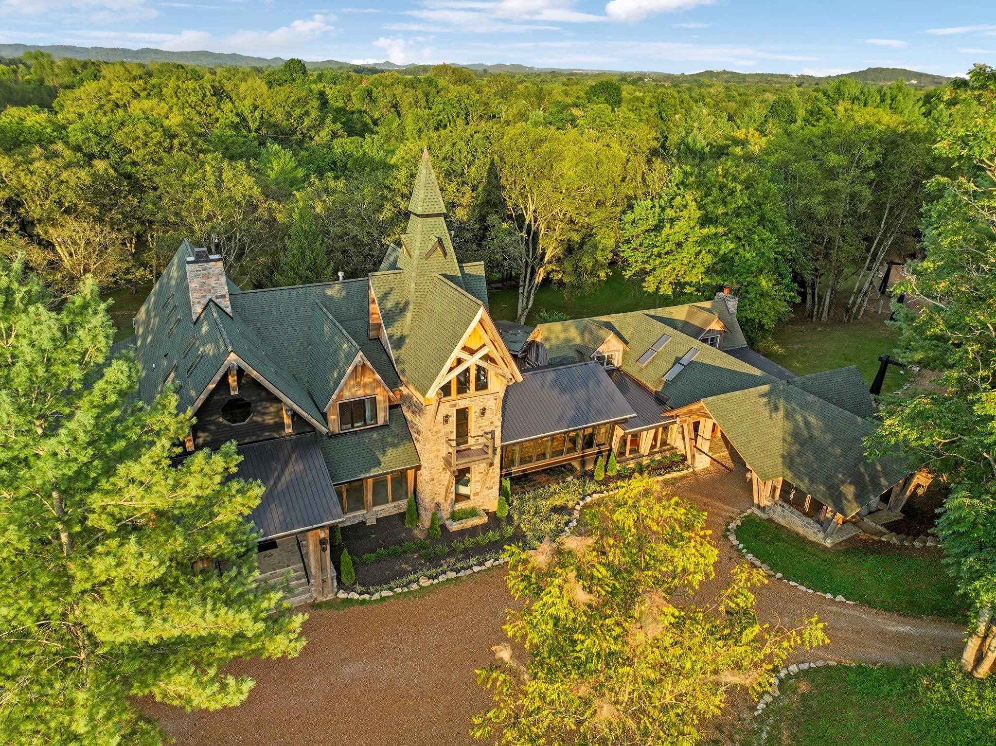 Dark Horse Estate - An iconic world-class compound & creative retreat; truly a legacy estate for the discerning few. This one-of-a-kind property encompassing 10 pristine riverfront acres, includes both famed Dark Horse Studios and the breathtaking Dark Horse Manor. Built with timeless heavy post-and-beam construction and wrapped in walls of glass, the estate spans over 23,000 square feet, plus an additional 3,000+ square feet of covered porches and walkways. Every corner of this property was crafted to inspire, entertain, and elevate.
THE MANOR HOUSE: in its entirety, includes The Manor, The Cottage, and The Bungalow Apartment, consisting of over 14,200 square feet of living space. Additionally, attached via covered walkways and not included in the square footage is the Party Barn and a 3-car garage. The Manor and The Cottage are connected via sky bridge/game room with a pool table. The Bungalow Apartment, connected to the The Cottage, also has its own private exterior entrance. 
DARK HORSE STUDIO: Built in 1998, and is world-renowned as a destination for A-list recording artists from all around the world. Like The Manor Estate, this approximately 8900 square-foot building is a combination of heavy post and beam construction but with a more rustic feel, creating a unique and immersive environment for artists. For decades, this space has fostered creativity and focus, allowing artists to escape the hustle and bustle of everyday life and find inspiration in a serene, nature-filled setting. This unique building consists of public areas, studios, and two separate sleeping quarters, along with multiple porches and patios.
It's impossible to fully describe this property in a few paragraphs. Please refer to the attached PDF in the documents for additional information and floor plans.