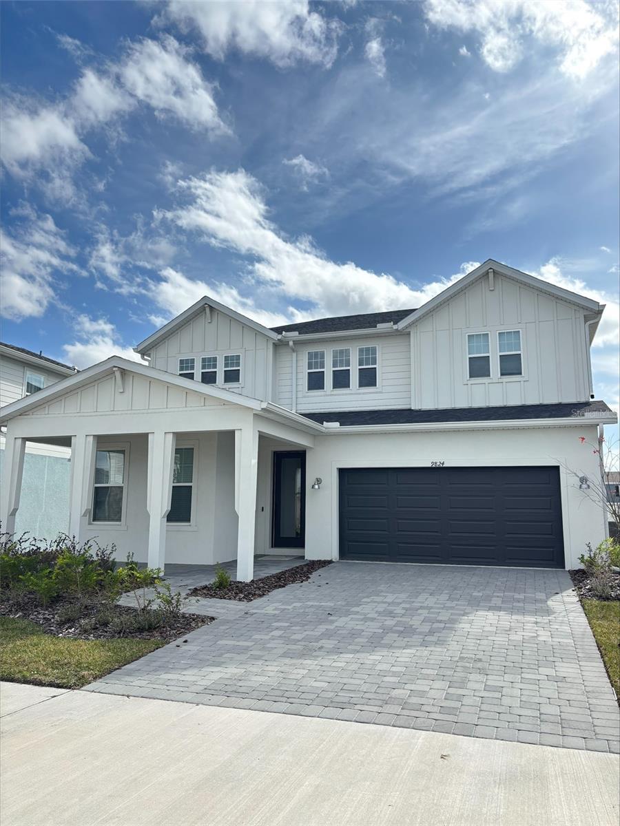 EverBe is a new master planned community where convenience and connections combine to create a new standard for home. Located in Orlando with quick access to 417 & 528, this lifestyle community will offer miles of pathways & trails, wi-fi-enabled green spaces, unique outdoor recreation areas, a fitness center, a clubhouse complex with resort pool, 2G internet, and a waterfront amenity and town center. Get excited for EverBe - everything home should ever be!Step into the Imperial, where luxury and convenience seamlessly combine to create a truly elevated living experience. This remarkable 5-bedroom, 3.5-bathroom home with a 2-car garage offers unparalleled craftsmanship and thoughtful design throughout. The open-concept layout flows effortlessly, creating an expansive, airy feel that exudes both sophistication and comfort. On the first floor, discover a private en suite bedroom with a walk-in closet and elegant quartz countertops—a perfect retreat for guests. At the heart of the home, the chef-inspired kitchen is a true masterpiece, featuring 42” soft-close white cabinetry, striking quartz countertops and decorative tile backsplash. Whirlpool stainless steel appliances, including a refrigerator, make cooking a pleasure. The kitchen seamlessly connects to the café and gathering room, where a sliding glass door opens to the covered lanai, enhancing the flow of indoor-outdoor living. The first floor also offers a convenient powder room, perfect for guests. Upstairs, the luxurious owner’s suite is a private sanctuary, featuring a spacious walk-in closet and a spa-like en suite bathroom with quartz-topped dual vanity sinks and a frameless glass enclosed shower. The loft area provides the perfect space to unwind, while three additional bedrooms and a bathroom complete the upper level. For added convenience, a thoughtfully located upstairs laundry room simplifies everyday tasks. Beautiful tile flooring is found throughout the main living areas of the first-floor, bathrooms and laundry room, while plush, stain-resistant Shaw carpet can be found throughout the bedrooms, loft, and staircase. Designer-curated finishes elevate every corner of this home, including pendant light pre-wire, wrought iron basket balusters with oak handrail at the staircase, matte black hardware and plumbing finishes, and 2” faux wood blinds enhance the home's style and comfort. This home is equipped with a smart thermostat, smart doorbell, digital IP camera pre-wire, and LED downlights, ensuring your home is as connected as it is beautiful. This home offers the perfect combination of luxury, convenience, and modern design—an ideal place to live and relax. Schedule a tour today!