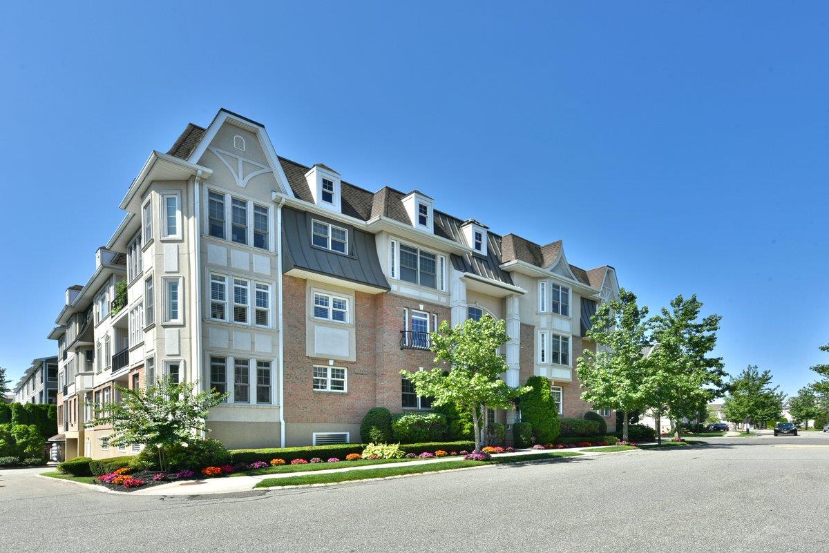 Welcome to 415 Pacing Way, a Beautiful 2 Bedroom Fairmont model with 2,054 sq ft of living space. The Stunning Open concept living room, dining area and eat-in kitchen make it Perfect for Entertaining and Everyday living. The Gourmet Kitchen boasts Custom cabinets, Granite countertops, Stainless steel appliances including a Sub Zero refrigerator. Tray ceilings, Crown moldings and Designer lighting create a Luxurious and Opulent feel to the home. The Primary Suite is the perfect retreat Featuring a huge Walk-in Closet and a Spa-like Bathroom with double sinks, shower and jacuzzi tub. The apartment also comes with 2 GARAGE SPOTS as well as 5 storage units; Meadowbrook Pointe features a 25,000 sq ft clubhouse offering amenities including an indoor and outdoor pool, fitness center & spa, tennis courts, library & conference room and much more. The apartment is located in a gated community with 24 hour security & conveniently located to shops, restaurants and highways. Enjoy resort living every day at Meadowbrook Pointe!, Just pack your Bags and Move Right In! Minimum Age 48.