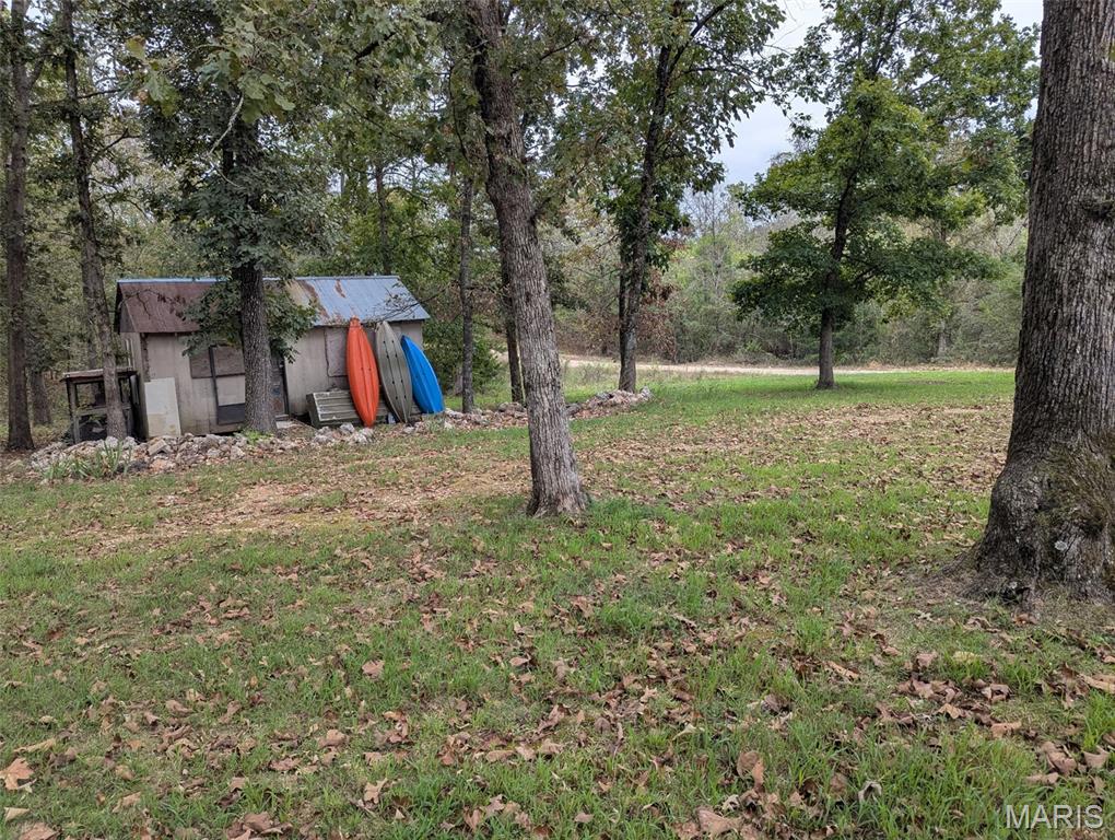 Beautiful lot offering water and electricity already connected, conveniently located approximately 6 minutes from the river. The existing shed will convey with the property. A trailer is currently located on the lot and will be removed by the sellers prior to closing. Please note, there is no septic system currently on the property.