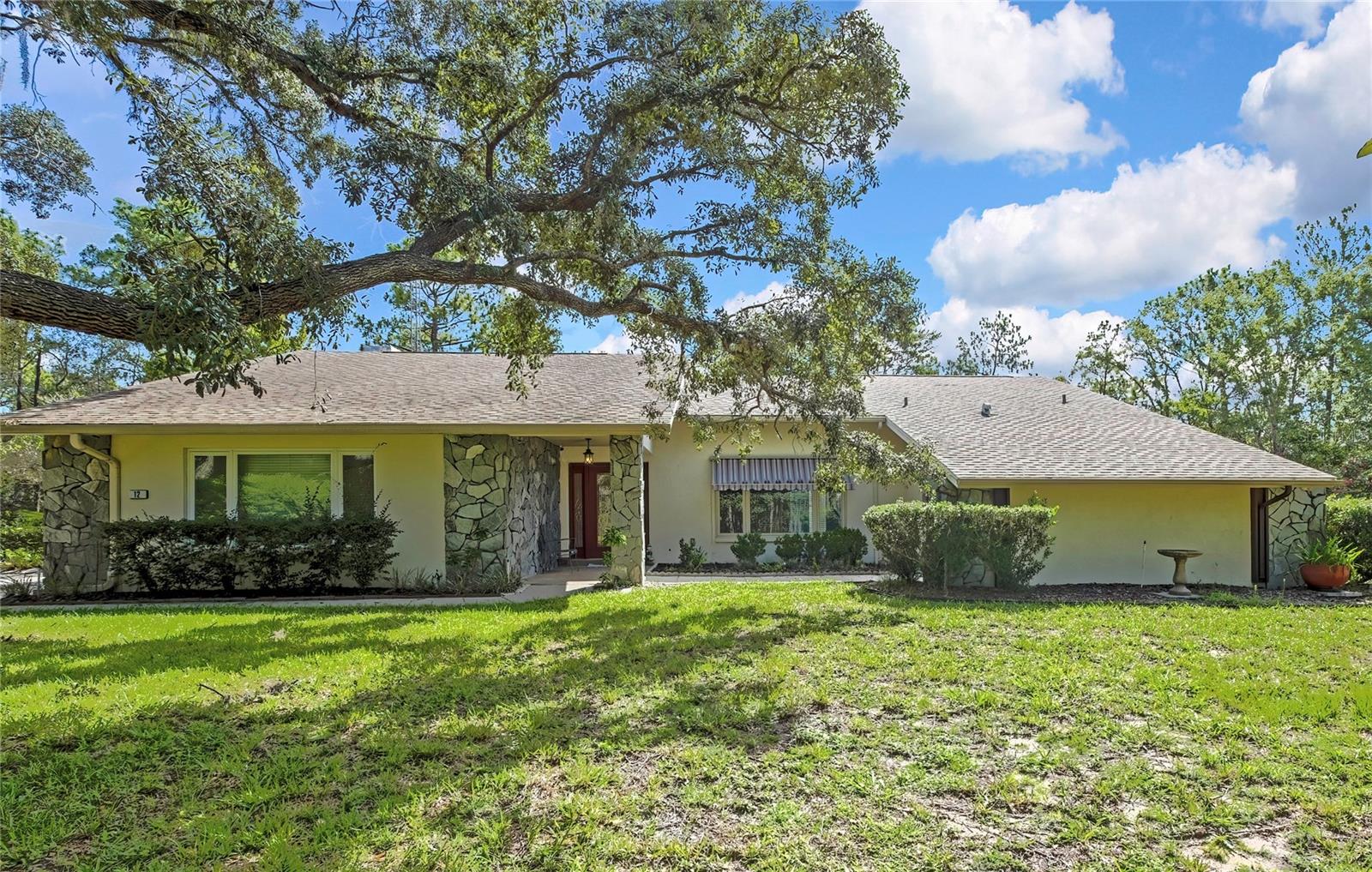 Luxury Pool Home on DOUBLE LOT with Signature Greenbelt Privacy in Sugar Mill Woods – Oak Village Immaculate 3-bedroom, 2-bath pool home situated in the middle of a rare DOUBLE LOT in desirable Oak Village of Sugar Mill Woods. MAJOR UPDATES provide peace of mind: a 2020 ROOF, 2021 HVAC system, 2022 WHOLE HOUSE water filtration system, 3 replacement windows (2022), and UPDATED kitchen APPLIANCES: a 2023 refrigerator, built-in island oven, and separate baking oven. This move-in-ready home offers exceptional privacy, quality, and spacious living in one of the Nature Coast's premier communities.The desirable SPLIT FLOOR PLAN features a spacious master suite with relaxing jetted tub and DIRECT ACCESS to the pool. The guest bedroom also OPENS to the lanai, ideal for guests or a private office. Formal living and dining rooms flow into a spacious family room and dinette highlighted by soaring VAULTED ceilings and a stunning etched stained-glass accent above the FIREPLACE. A BUILT-IN WET BAR with glass shelving and additional cabinetry creates the perfect entertaining space.Double-pane windows fill the home with natural light. The well-appointed kitchen features abundant cabinetry, GENEROUS counter space, a GARBAGE COMPACTOR, updated appliances, and a breakfast nook with sliders opening to the pool and lanai. An OVERSIZED laundry room with overhead shelving and an OVERSIZED GARAGE with WORKSHOP AREA and UTILITY SINK provide excellent functionality. The enclosed permit verified UNDER ROOF STORAGE ROOM with a NEW concrete slab offers additional space for hobbies, lawn equipment, tools, and seasonal storage.Outdoor living shines with a screened pool and expansive covered lanai overlooking a signature Sugar Mill Woods greenbelt, offering peaceful WOODED VIEWS and exceptional PRIVACY with NO REAR or FRONT neighbors. The carpeted lanai provides additional comfort around the pool, and the pool robot with new filter conveys. The home's OVERSIZED DOUBLE LOT and surrounding greenbelt system create a tranquil, park-like setting unique to Sugar Mill Woods.Enjoy luxury living with LOW HOA fees, underground utilities, and a location OUTSIDE FLOOD ZONE. Sugar Mill Woods offers the flexibility of an active COUNTRY CLUB LIFESTYLE only if desired. OPTIONAL memberships provide access to golf, tennis, pickleball, fitness facilities, swimming, clubhouse dining, and social activities without mandatory membership fees.Conveniently located near shopping, hospitals, restaurants, and the Gulf of Mexico, this home places you in the heart of Florida's Nature Coast. Enjoy the crystal-clear waters of Crystal River, Homosassa Springs, Chassahowitzka River, Rainbow River, and Weeki Wachee for boating, kayaking, fishing, paddleboarding, and swimming, along with opportunities to view protected MANATEES and DOLPHINS in their natural habitat. The nearby SCENIC SUNCOAST TRAIL system offers 50+ miles of paved walking and biking trails through Florida's natural landscapes. Experience the perfect blend of luxury living, privacy, recreation, and the relaxed Florida lifestyle. This exceptional location offers the perfect blend of luxury living, privacy, natural beauty, and the relaxed Florida lifestyle.