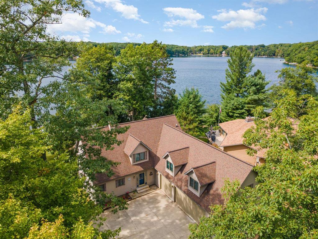 Welcome to your dream custom built waterfront home! Back on the market after a long winter! This beautiful property offers almost 4000 square feet of luxury finished living space, featuring 5 bedrooms and 4 baths. This beautiful home is nestled in a private subdivision with breathtaking views of serene Arnold Lake in northern Clare County. With 100' of sandy frontage and crystal clear sparkling water on this 118-acre all sports lake, you'll enjoy endless water activities from your own backyard. The home boasts many structural custom built attributes including 2x6 framing, an 8' poured wall full finished basement, custom windows offering views of the water from almost every vantage point, larger natural gas hot water heater, large insulated 3+ car garage with extra high 7' doors, and a maintenance free composite deck overlooking the lake. Step inside and you will delight in the large great room with beautiful views of the lake. A gas fireplace adds warmth and ambiance for cozy evenings. A main floor primary private bedroom/bath offers privacy and solitude. The finished full walk-out basement encompasses a large family room, a full finished bath and finished bedroom. On the upper level are 2 more bedrooms and a huge bonus room that will accomodate all those extra guests! This beautiful pristine home offers many more wonderful ammenities too numerous to mention. We think you will love the primary bedroom suite, the large great room, the kitchen and dining area offering ample room for many guests, and that the quietness of the home. This property is located in upscale Woodshaw Estates subdivision and HOA: a new owner will appreciate the exclusivity of living in a private HOA with Deed Restrictions and By Laws that dedicates itself to ensuring your property values are maintained. Conveniently located just 2 miles from the US 127 exit on paved roads, this waterfront oasis offers the perfect blend of luxury, comfort, and accessibility. Room for everyone!