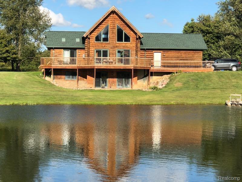 Farmer / Hunter / Fisherman's delight! Hunt and Fish on You Own it ALL! No need to drive hours north this property has it all. This is a working Farm, currently leased, Income Property!  Lake / oversized Pond is fully stocked. Deer, Turkey it's all here. This is a totally unique property on more than 62 acres and adjacent 160 + acres great for hunting.  Home is a true Log Cabin with 4 Bedrooms, Great room with deck over looking Lake and Land. Walk-out lower lever leads right to the waters edge. The large barn is great for storage. Property has been a farm / grow site with possessing building, currently soy beans rotates to corn & alfalfa. Was a 420 Grow facility. Be your own Farmer, teach them how to Fish, Hunt and care for the Land. Do you want to feel your far from it all yet your close to everything? Less than an hour from Rochester Hills south, hour from the Blue Water Bridge east and Lansing to the west, Frankenmuth 20 Minutes north, I 75 just minutes west. Land Contract terms offered. This property is so much more... this is a total must-see! Close to M15 for easy accessibility... Farm, Woods, Lake & Land Land Land. This Has It ALL!