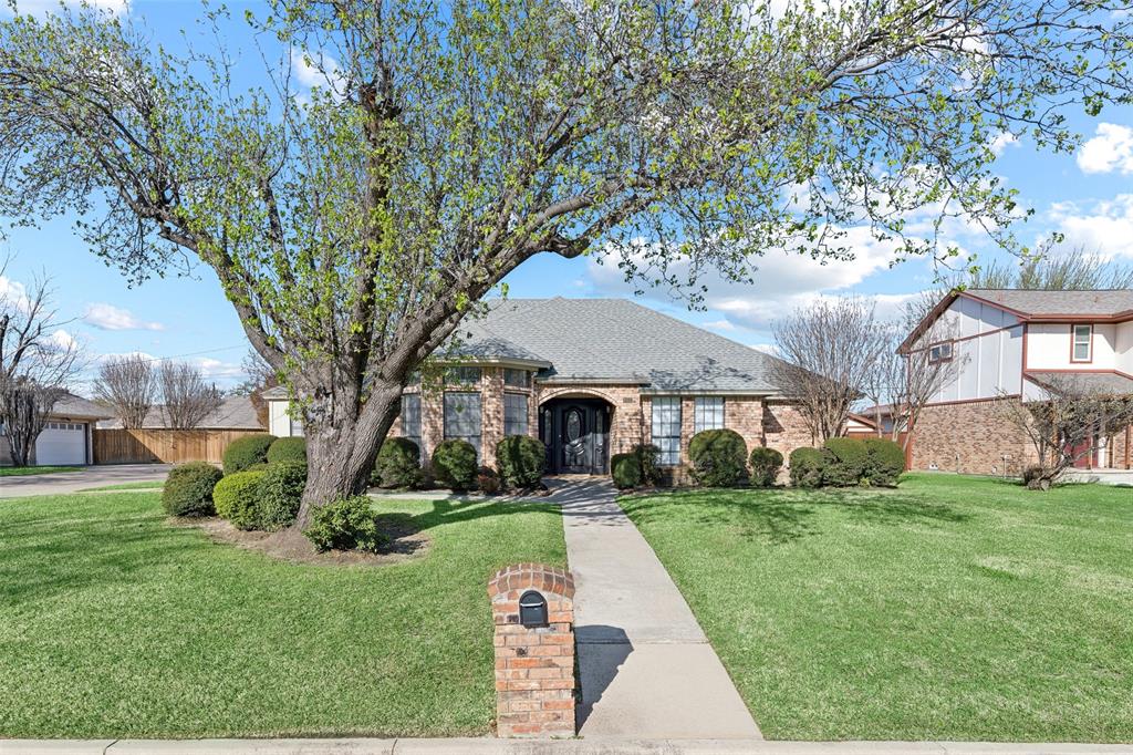 Beautifully maintained one-owner home. Exquisitely remodeled with fresh paint, luxury vinyl plank flooring and lighting throughout. Kitchen has crisp white cabinetry, granite countertops, timeless white subway tiled backsplash and stainless appliances. Both the formal dining and breakfast nook have bay windows. Fireplace is the focal point in the large living area. Updated primary ensuite bath includes quartz vanity countertop, modern freestanding tub and an oversized shower with frameless glass door.  Two closets, a huge walk-in 12x4, plus a second closet provide ample storage in the primary bath. Secondary bedrooms, both with walk-in closets are split from the primary suite. Guest bath updated with a granite vanity top and has a skylight. Sunroom with wainscoting walls has a ceiling fan and is accessed from the living room or the garage. A pergola awning topped patio overlooks the large backyard that has a nice sized storage barn. Full yard sprinkler system.