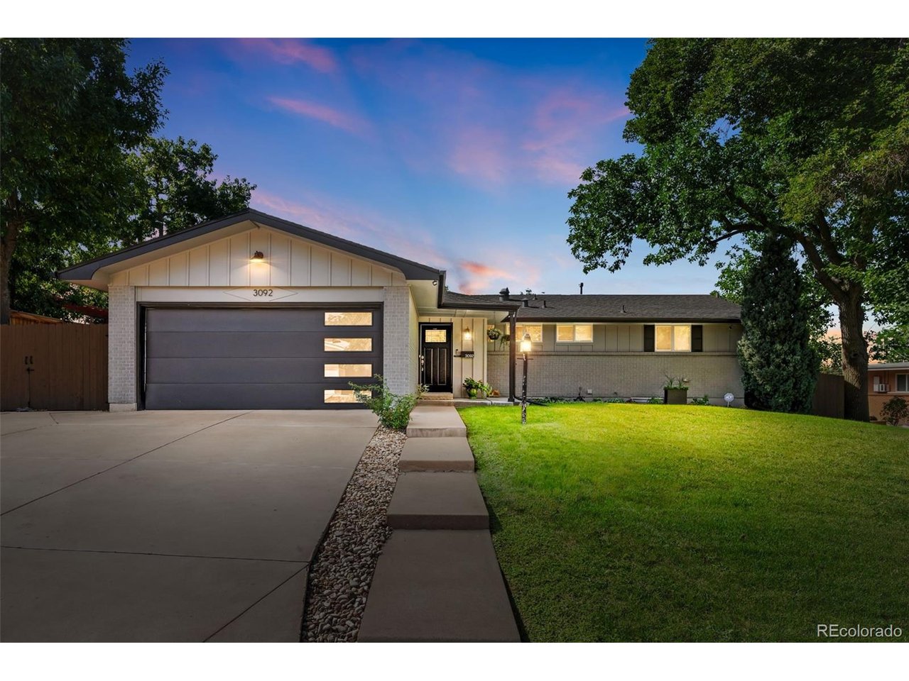 Welcome to this beautifully maintained, thoughtfully updated and truly turn-key ranch in Centennial's sought-after Dream House Acres. Meticulously cared for and extensively improved, this is the kind of home where you can simply unpack and start enjoying.The bright, open main level is anchored by a true chef's kitchen featuring a HUGE center island, quartz countertops and abundant cabinetry, with plenty of room for cooking, gathering and entertaining. The adjoining living area is warmed by a striking floor-to-ceiling tiled gas fireplace and skylight, while the oversized primary suite offers two closets, including a walk-in, and a beautifully updated private bath with double-sink vanity.The completely remodeled basement is every bit as impressive, filled with designer touches and featuring a spacious second living area with another gas fireplace, stylish wet bar, two additional bedrooms, a huge laundry/utility room with exceptional storage, and a fun hidden closet tucked beneath the stairs.Outside, the sprawling backyard features all-new professional landscaping and sprinkler system, raised garden beds, a patio perfect for relaxing or entertaining, and beautiful mountain views. Additional driveway parking plus gated, fenced parking provides space for an RV, trailer or other recreational toys.And the improvements go well beyond what you can see, including a new sewer line, tankless water heater, radon mitigation system and newer windows.The location is hard to beat! Stroll to neighborhood favorites Na Favola, Sazza and Menya Sushi, or grab coffee and groceries at nearby Trader Joe's. The High Line Canal Trail is just moments away, offering miles of scenic walking, running and biking, with Goodson Recreation Center and deKoevend Park also nearby.Beautifully finished, lovingly maintained and genuinely move-in ready, this is a home where the work has already been done-just move in and make it yours!