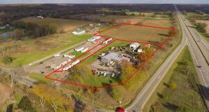 3 properties.  Truck repair business, & vacant development lant to the east.  3 parcels, est. 17 acres + or -.  Easy off, easy on right side of exit # 139 of westbound I - 94.  North East corner property. Current use is Commercial,Other.