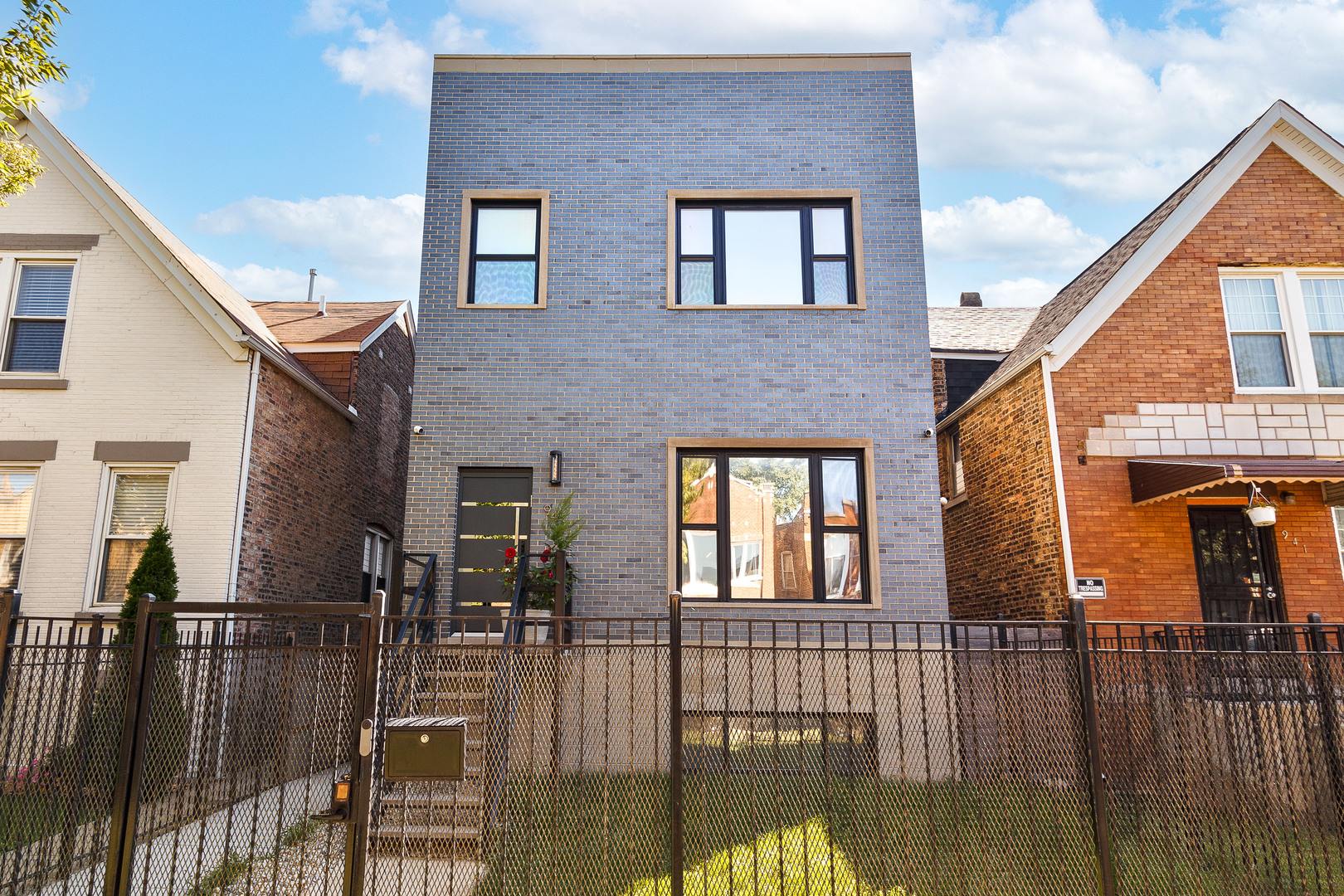 Modern Luxury in the Heart of Humboldt Park    Experience exceptional city living in this stunning 5-bedroom, 5.5-bath residence - only 4 years old and packed with upscale finishes, smart home technology, and incredible entertaining spaces.    Step inside to a wide-open main level featuring a large living room with a sleek electric fireplace, a kitchen that offers Samsung Smart Appliances, a 12-foot quartz island, and a dedicated dining area with a built-in wet bar. A glass-lined staircase leads you to the upper and lower levels, while adding to its contemporary elegance.    The second floor offers three bedrooms, each with its own walk-in closet and en-suite bath. The primary suite is a true retreat with two walk-in closets and a spa-inspired bathroom featuring floor-to-ceiling quartz, a dual-head shower, soaking tub, dual mirror televisions, and a toilet with bidet. Convenient laundry on both upper and lower levels ensures ease of living.    The lower level is designed for entertainment with a private theater room/fourth bedroom and bath, a spacious family room with wet bar and wine fridge, and another bedroom for guests or extended family.    Enjoy Chicago skyline views from your rooftop deck - complete with wet bar - or relax on the rear deck. Smart home amenities include a full Google Nest suite with thermostats, doorbells, and security cameras.    Set in the fast-growing Humboldt Park neighborhood, this luxury residence combines modern design, exceptional comfort, and unbeatable city access.
