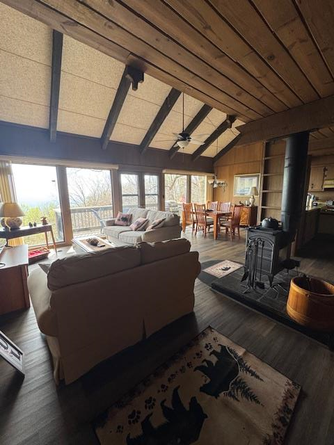 Welcome to this beautiful Doe Run/Groundhog Mountain end-unit villa, ideally located just off the Blue Ridge Parkway. This well-appointed home features floor-to-ceiling windows that showcase breathtaking long-range views toward Mount Airy, filling the space with natural light.  The main level offers an open-concept kitchen, dining, and living area accented by vinyl plank  flooring and a cozy wood-burning fireplace—perfect for relaxing or entertaining. The lower level includes two spacious bedrooms and two full baths, providing comfortable accommodations for family and guests.  Enjoy outdoor living with two large walkout decks, ideal for taking in the peaceful mountain surroundings. This home is being sold mostly furnished, making it truly move-in ready and well-suited as a primary residence, vacation retreat, or potential income-producing property. It is currently a very popular Airbnb rental.    The property is served by community water and septic.  Residents enjoy a variety of amenities, including tennis courts, a community building, and a stocked fishing pond—enhancing the mountain lifestyle experience.  Conveniently located just 10 miles from Fancy Gap, 13 miles from Mabry Mill, 18 miles from Chateau Morrisette Winery, and 29 miles from Floyd, this property offers both tranquility and accessibility.  Experience the peaceful setting and scenic beauty this mountain villa has to offer—schedule your private