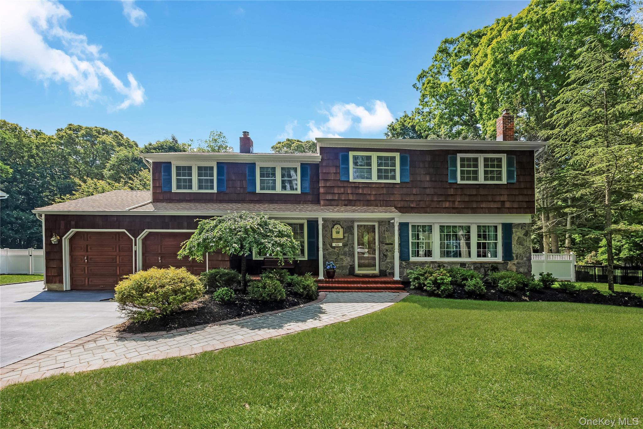Welcome to your private retreat, where comfort, space, and timeless charm come together!Set on a beautifully landscaped .71 acre property, this spacious 5 bedroom, 2.5 bath home in the heart of Smithtown, nestled in the beautiful Forestwood section, offers the perfect blend of elegance, functionality, and outdoor living.Featuring gleaming hardwood floors throughout and a thoughtfully designed layout ideal for both everyday living and entertaining. The heart of the home is the beautiful eat-in-kitchen, featuring granite countertops, tons of cabinetry, and plenty of room for casual meals and conversation. For larger gatherings, the formal dining room provides a warm and inviting setting for holidays and special occasions.Relax in the spacious living room, unwind by the wood-burning fireplace in the cozy den, or enjoy movie nights and game days in the separate oversized family room. With five generously sized bedrooms, there’s plenty of space for family, guests, or a home office.Step outside and discover your own backyard oasis. Multiple decks extend the living space outdoors, creating the perfect setting for barbecues, celebrations, or quiet evenings under the stars. The inground freshwater pool invites you to enjoy summer days in style, while the lush gardens, colorful flowers, and mature plantings add beauty and tranquility year round.An amazing standout feature is the large 2 car barn in the backyard, ideal for hobbyists, gardeners, workshop space, extra storage, or parking additional vehicles.This incredible property offers the rare combination of indoor comfort, outdoor enjoyment, and versatile space, all in a setting that feels both welcoming and private.IGS, CAC, 150 Amps