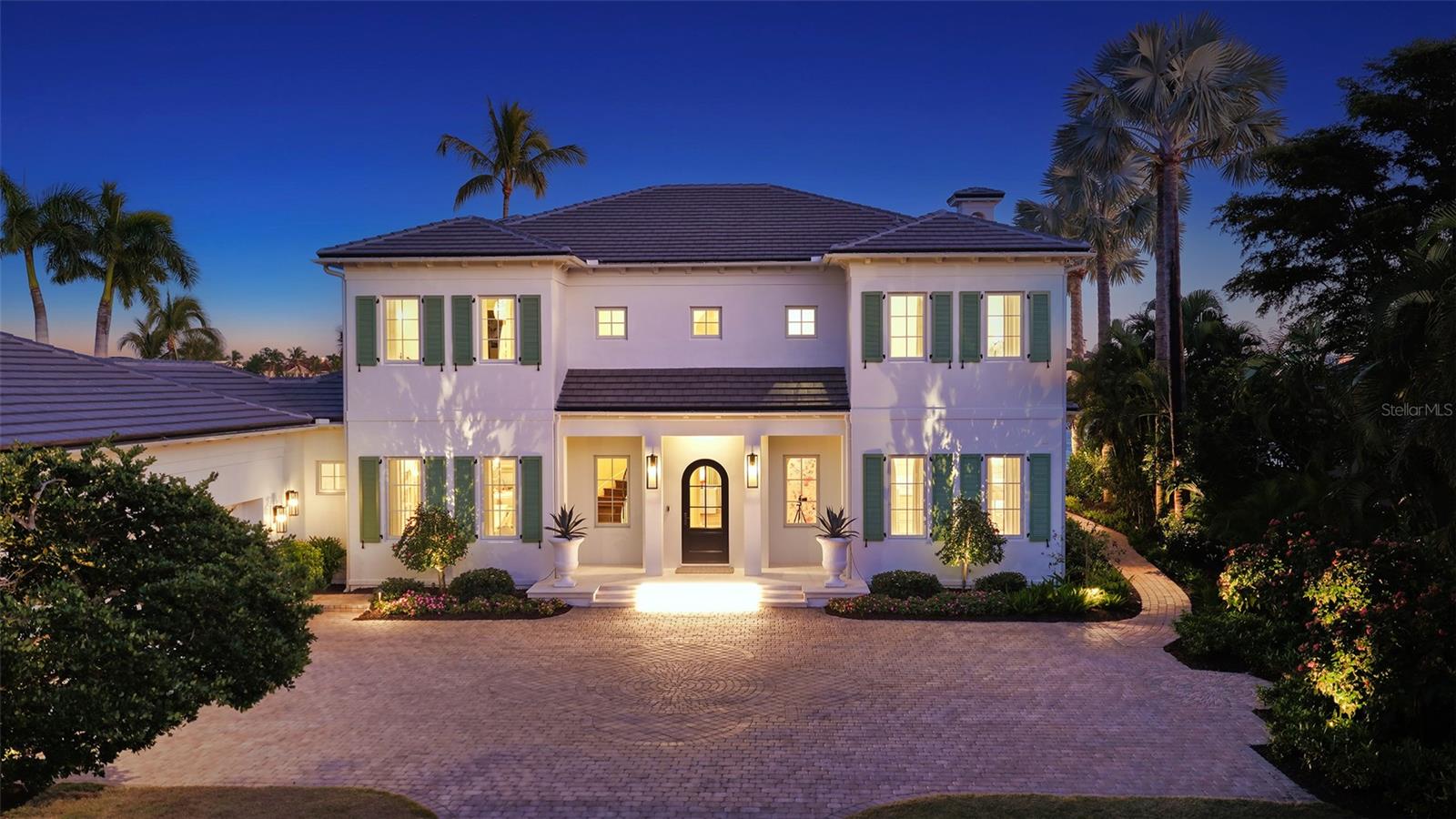 This bespoke crafted casually elegant furnished residence is in the exclusive gated Lighthouse Point waterfront enclave of just 16 custom residences at the southern tip of Longboat Key. Lighthouse Point is a peninsula nestled on a deep-water boat basin at the edge of the Intracoastal Waterway and New Pass. This residence has been completely remodeled within the past couple years, taken down to the studs to create the ideal coastal waterfront estate. The improvements included new impact glass windows and doors throughout and a new tile roof. The furnishings are chosen to make the space comfortable for both relaxing seaside living, as well as hosting family and guests. No detail has been overlooked. The first level includes an open floor plan with a living, family and dining room with a separate media room, and the fifth bedroom with double bunk beds for the little ones. Entering this stunning home, you are welcomed into a grand space, and beyond the beautiful kitchen with island seating, that includes the La Cornue French gas range as the focal point. The living and family rooms each have a gas fireplace. The main floor rooms overlook an expansive terrace and large heated pool with sun shelf chaises, back yard with plenty of space for games, private beach, and the Gulf of Mexico. Take the stately staircase or elevator to the second floor where the primary bedroom and three en-suite guest bedrooms are. The primary and two of the guest suites connect to a wide terrace overlooking the Gulf and Longboat Pass. Enjoy the Gulf’s vibrant sunset skies from the primary suite with spacious bedroom living space, meticulously appointed spa-like bath area, three walk-in closets and gas fireplace. There is a three-car side entry garage with room for storage. Down the street at the community dock is a new 16,000lb boat lift. Owners in the Lighthouse Point neighborhood enjoy their own tennis court plus the nearby gulf front beach, easy access to the Resort at the Longboat Key Club and the Links Golf Course and fitness center with famed St. Armand’s Circle shopping and dining district just over a mile away. Sarasota and its famed arts and entertainment is just 5 miles away. .