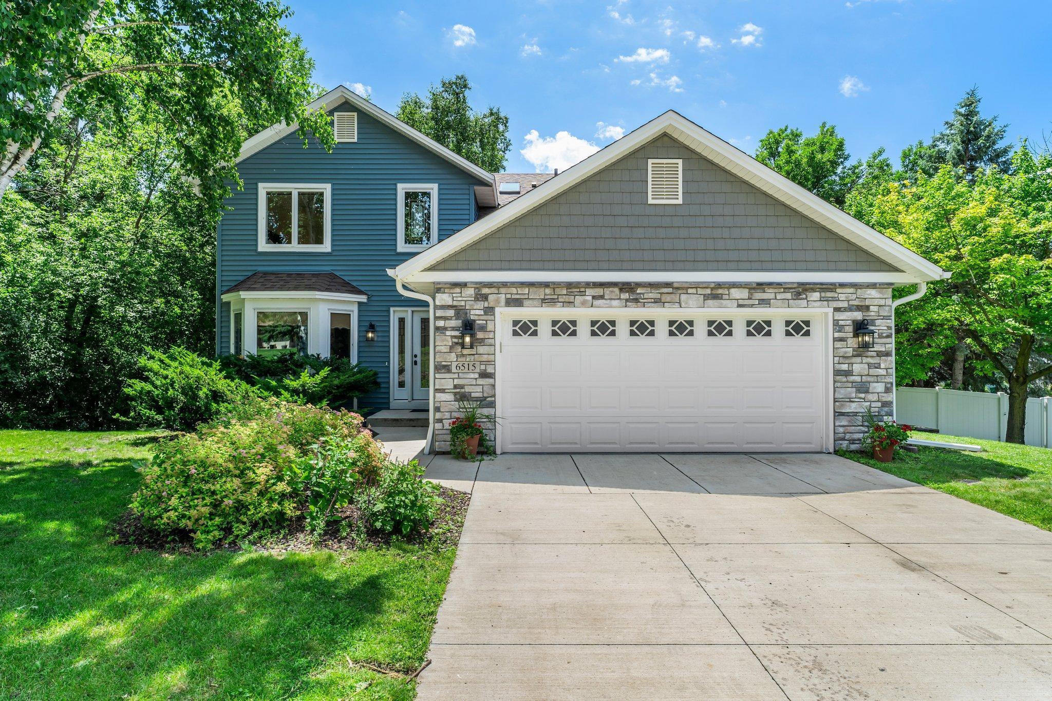 Tucked away on a scenic corner lot in a quiet Chanhassen cul-de-sac, this beautifully maintained 3-bedroom, 4-bathroom home offers the perfect mix of comfort, style, and convenience. Just minutes from Lotus Lake, Purgatory Creek trails, and multiple parks, with easy access to shopping and dining, this location enhances everyday living.

Inside, a dramatic 2-story foyer with 17-foot ceilings and a statement chandelier sets the tone. The main level boasts a sunlit family room with a bay window, wood floors, fireplace, and custom built-ins, along with a formal dining room and an open-concept living area. The oversized kitchen is a showstopper with panel-ready appliances, double ovens, extensive cabinetry, and a large center island. A bright office nook, stylish powder room, and a well-equipped laundry room complete the main floor.

Upstairs, the primary suite features 11-foot ceilings, LVP flooring, walk-in closet, and a spa-inspired ensuite with skylight. Two additional bedrooms share a full bath with tiled tub/shower and another skylight. The finished lower level includes a large rec room with built-ins, fireplace, wet bar, and walkout access to the backyard, plus a ¾ bath and heated tile floors.

Outside, enjoy a 2-car garage, two-tiered deck, concrete patio, fenced backyard, and lush landscaping. Extensive updates from 2021–2025 make this home move-in ready and truly exceptional.