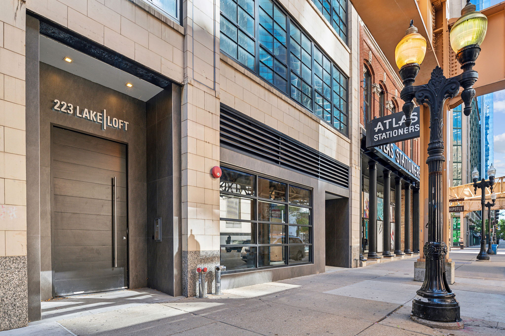 DEVELOPER CLOSEOUT! LAST REMAINING UNIT at 223 Lake Lofts, a truly one-of-a-kind luxury boutique loft condominium building.  Experience unrivaled luxury and modern design in every detail at this exceptional development. Each loft-style condominium showcases thoughtful craftsmanship, with no expense spared to create a living space that blends elegance with industrial charm. Step directly into your home via private elevator access, where expansive open floor plans, oversized black framed windows, and soaring ceilings-ranging from 11.4 to 14.5 feet-create a sense of grandeur. The space is adorned with rich white oak engineered hardwood flooring, exposed brick, and stunning timber beams, all complemented by wine racks and sleek, modern finishes. At the heart of each residence is a state-of-the-art kitchen designed for both style and function. Enjoy cooking and entertaining with top-of-the-line Wolf and Sub-Zero stainless steel appliances, luxurious quartz countertops, a spacious eat-in kitchen island, and white cabinetry featuring soft-close drawers.  Additional features include a secure underground parking garage, fob access and two high-speed elevators for seamless access. Perfectly located just steps from the Chicago Riverwalk, Fulton Market, multiple public transit options, and an array of high-end dining, shopping, and cultural landmarks, this exceptional development places the best of Chicago at your doorstep. A truly rare offering for the discerning buyer. Attached garage parking available for purchase.
