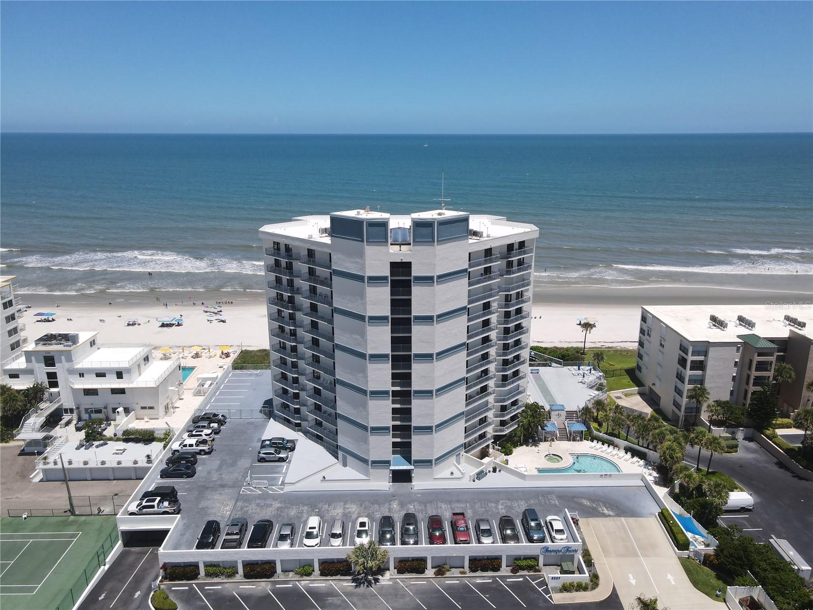 Experience ultimate privacy and relaxation in your very own direct oceanfront condo, situated on the peaceful "no-drive" beach on the lovely New Smyrna Beach. This beautiful and meticulously maintained one-bedroom residence is priced to sell and is completely move-in or rental-ready. Located on the eighth floor, the unit offers breathtaking views at the exact level where pelicans glide past your private balcony. The condo comes fully furnished and well-stocked with beach gear—all you need to bring is your toothbrush. Whether you prefer relaxing on the quiet, carefree sands or lounging by the heated pool, Seascape Towers offers an ideal retreat. The pool is perfectly positioned on the southern side of the building and below the main level, providing a secluded sunbathing haven shielded from cool northern winds. Seascape Towers is close proximity to Flagler Avenue Restaurants and shops, Canaveral National Seashore and JB's Fishcamp!  Don't miss the opportunity to own this wonderful, serene property. Buyers and their agents shall verify any information deemed important.