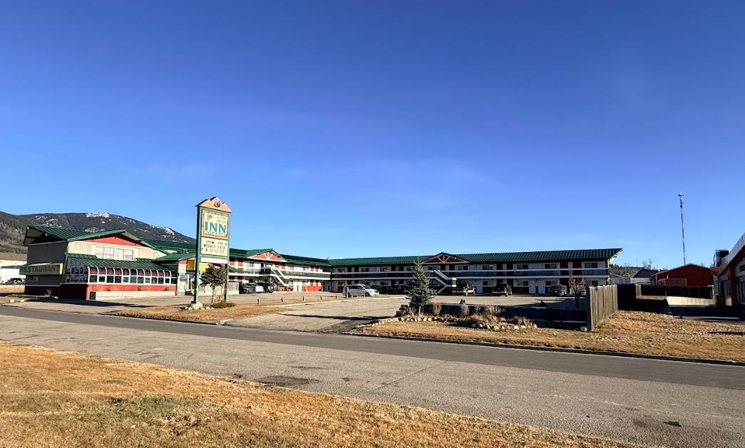 Alpine Lodge Motel in Grande Cache, AB offers 34 well-maintained rooms on a 37,600 sq ft lot, including 20 kitchenette units and 14 standard rooms. The property includes an on-site manager’s suite, a leased 1,700 sq ft sushi restaurant, lobby, front office, laundry facility with 3 washers and 1 dryer, electrical and boiler rooms, and a paved, landscaped parking area. Since 2019, approximately $247,000 has been invested in key upgrades such as heating and water-line replacement, new doors and windows, card-key access, security cameras, furniture, and a new boiler and hot-water system.The motel is strategically positioned to serve Grande Cache’s strong industrial economy. Located in the Montney Basin, the region supports ongoing metallurgical coal mining, natural gas and oil activity, forestry operations, and a major natural gas–fired power plant. Worker accommodation demand remains consistently high from construction crews, mine workers, and rotating energy-sector personnel. Seasonal tourist traffic also contributes, with Willmore Wilderness Park drawing hikers, hunters, and outdoor enthusiasts throughout the year.This is a turnkey opportunity in a resilient market with steady worker demand and growing recreational visitation.