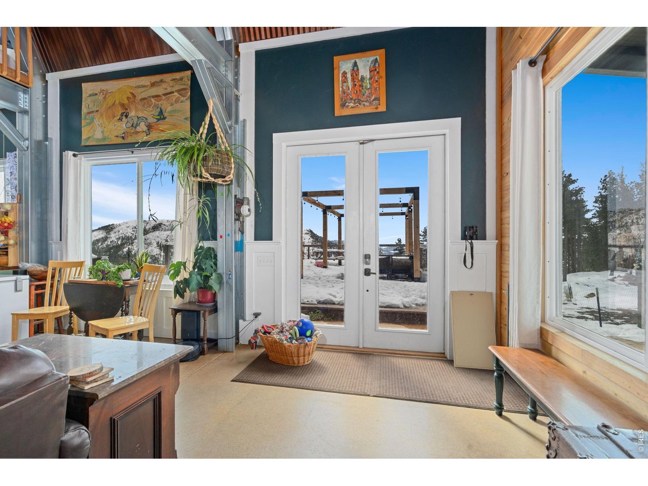 This is quintessential Colorado living. The VIEWS! Take a look to the south side of this home to views of the Masonville Valley and the backside of Horsetooth. The home is modern with radiant heat, open beamed ceiling, and a spacious loft and office area. Two nice size bedrooms upstairs. Main level primary with large soaking tub. Large deck offers a private place to relax or entertain. Plenty of storage with over-sized garage and shed. The small silo would be a great art studio or s/he shed. 40 minute drive to Old Town. HOA is for road maintenance.