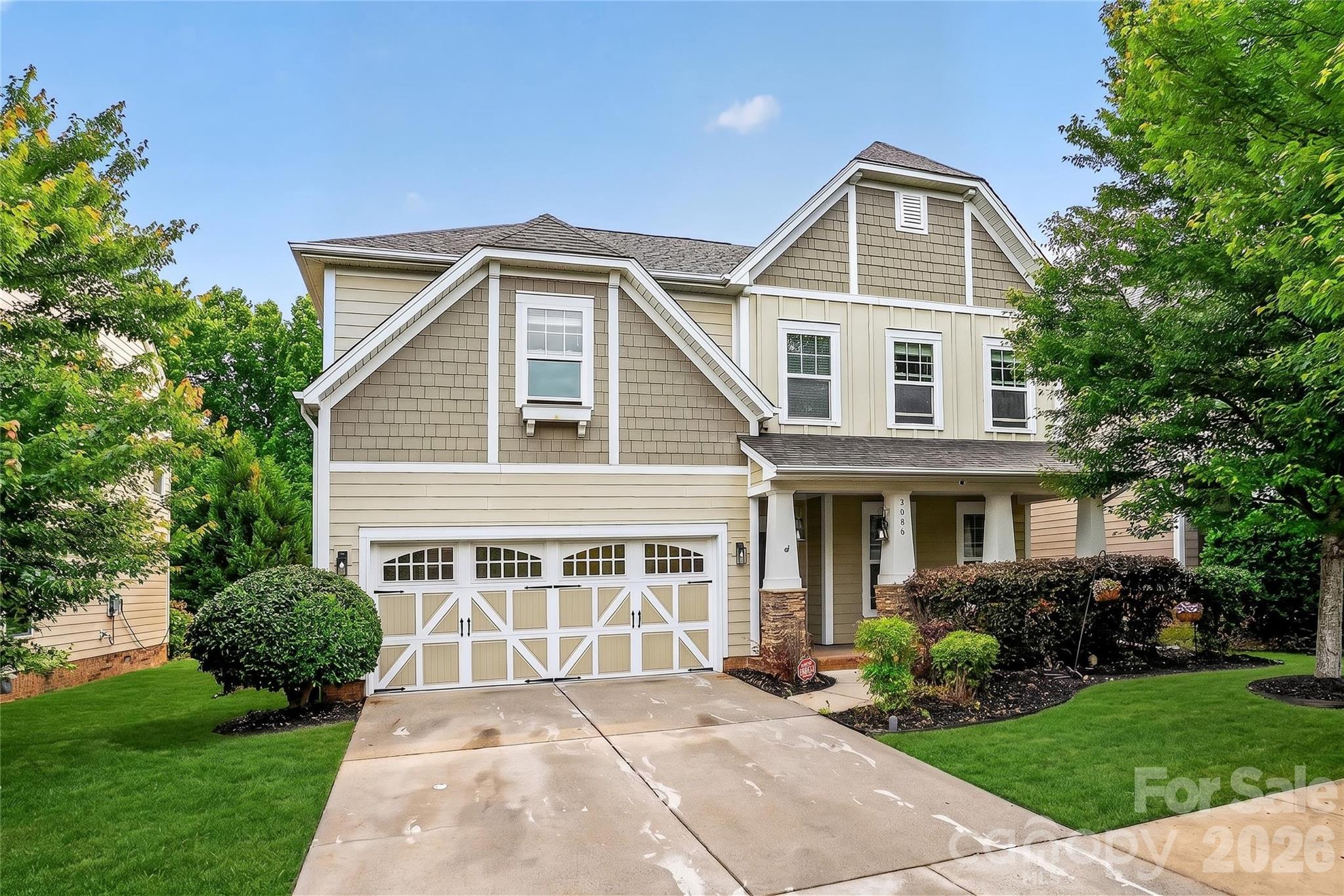 Welcome to Millbridge in Waxhaw, located within the Kensington Elementary and Cuthbertson school districts. Situated on a private wooded lot, this 5-bedroom, 2.5-bath home offers an open floor plan with hardwood floors and detailed woodwork throughout the main level. The gourmet kitchen features a large island, stainless steel appliances, stacked 42” white-painted cabinets, a walk-through pantry, and views of the wooded backyard. The dining area opens seamlessly to the kitchen and living spaces, creating a functional layout for everyday living and entertaining. The spacious great room includes large windows for natural light and a corner fireplace. A rear staircase provides convenient access to the second floor.Upstairs, the primary suite includes a large walk-in closet and ensuite bath. Three additional bedrooms share a dual-sink bathroom, and the laundry room is conveniently located upstairs. The fifth bedroom offers flexibility for a home office, guest room, or bonus space.Outdoor features include an extended concrete patio with café lighting overlooking a wooded backyard. Additional updates include upgraded carpet, fresh interior paint, designer light fixtures, and a two-car garage.Millbridge amenities include a clubhouse, fitness center, walking trails, and community pool..This is Millbridge living at its best. Come see why homes here don't last!