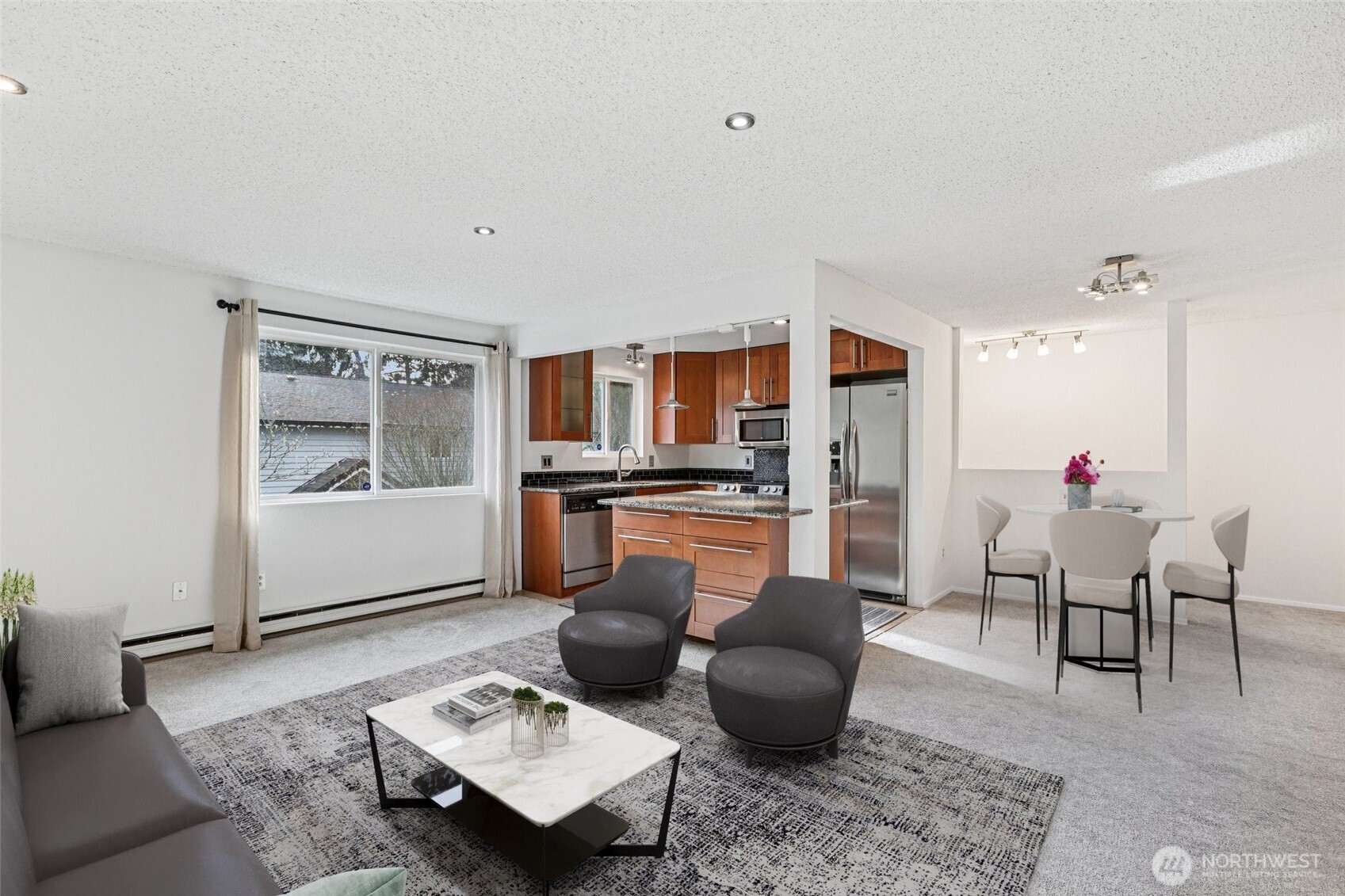 Enjoy a spacious, updated top-floor condo in a private, peaceful setting overlooking the beautifully maintained community courtyard. The remodeled kitchen features granite countertops, tile flooring, stylish cabinetry, and stainless-steel appliances, opening seamlessly to a bright living room with tons of natural light. The large primary bedroom offers dual closets, while double-pane windows enhance comfort and efficiency. Additional highlights include a newer roof and plumbing, fresh paint throughout, a full bath plus a convenient half bath with in-unit laundry. All appliances included. Ideally located near bus lines, light rail, freeways, hospitals, schools, restaurants, shopping, and vibrant downtown Edmonds. HOA covers water, sewer, garbage, and landscaping. No rental cap! FHA/VA Approved Community!