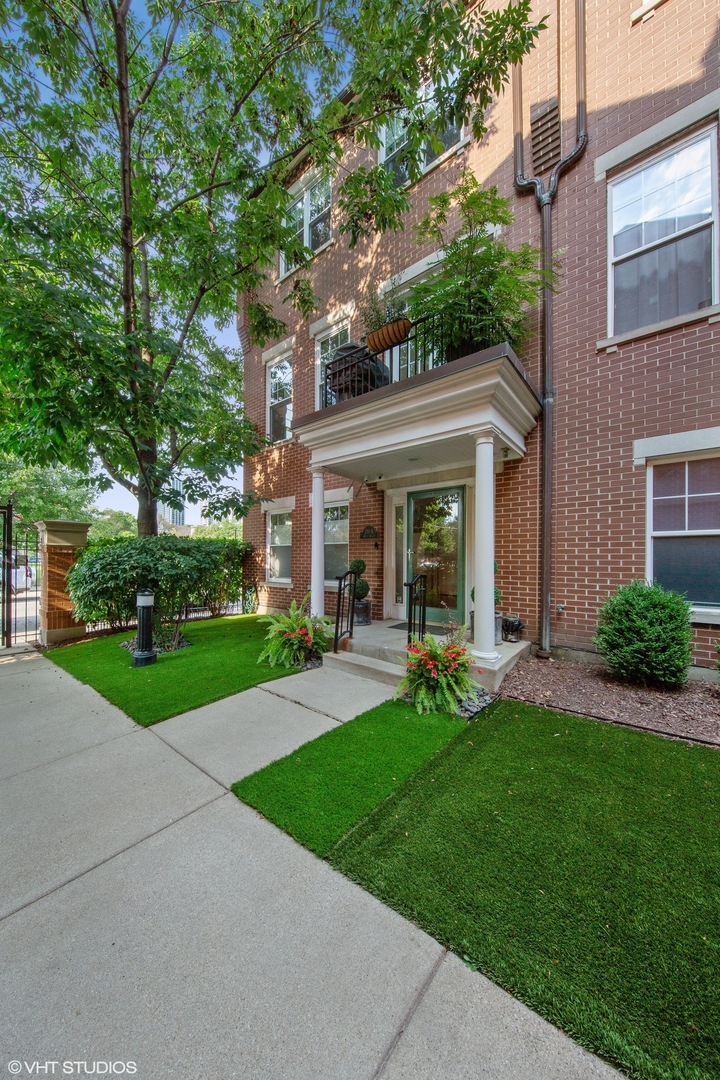 Sophisticated 3-bedroom, 2.1-bathroom END unit townhouse in the gated Old Town Square! The 3-story brick townhouse lives like a single-family home and overlooks a tranquil courtyard and the park greenery next door from the 2nd set of windows that interior homes lack. The first level features a large family room, a half bath, and direct access to the heated 2-car garage. The 2nd level showcases an open living, dining, and kitchen layout, with a front and rear balcony and a gas, ventless fireplace with a beautiful mantel. The recently updated gourmet kitchen features a breakfast bar, a large waterfall island, 2 large capacity beverage fridges, and high-end stainless-steel appliances. The sun-drenched, 3rd-level master suite features a spacious bedroom with large, organized closets and vaulted ceilings. The marble master bath has a walk-in shower with glass doors and a rain shower head, along with double sinks and a deep soaking tub. Two additional bedrooms, a 2nd full bathroom, and a laundry room finish off this level. The rooftop deck is perfect for entertaining and boasts spectacular city views. Enjoy the proximity to public transportation, schools, restaurants, bars, shopping, and everything else that Old Town and the Gold Coast have to offer.