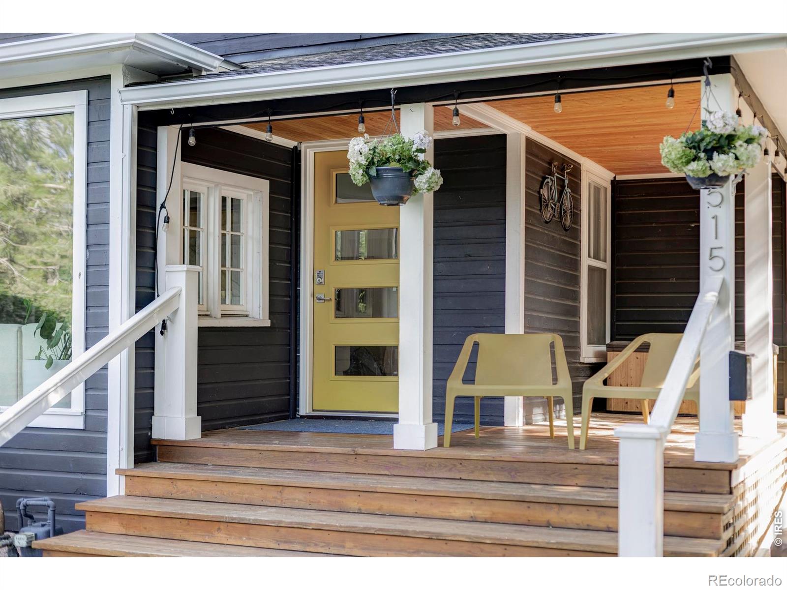 2515 Bluff Street is a thoughtfully updated 3-bedroom, 3-bathroom home in Boulder's Whittier neighborhood, offering 1,911 square feet of light-filled living space on a peaceful, tree-lined street just minutes from Pearl Street, 28th Street, and Downtown Boulder amenities. A covered front porch welcomes you into a sunlit living room with expansive windows, treetop views, and custom built-in bookshelves that add warmth and character. The main level includes a bedroom with sliding barn door and easy access to an attached bath, ideal for guests or a home office. The updated kitchen blends timeless style with modern function, featuring butcher block countertops, a farmhouse sink, gas cooktop, eat-in bar seating, and seamless flow into a dedicated dining room. Double sliding glass doors create an effortless indoor-outdoor connection to the expansive patio, making entertaining easy. A combined pantry and laundry area leads to a mudroom with driveway access and into a spacious vaulted bonus room with skylights, a bathroom, and private backyard entry, offering flexible space for a studio, office, lounge, or potential primary suite. Upstairs, two bright bedrooms with tall ceilings and skylights are joined by a bathroom and a versatile media room with built-in shelving. The private backyard retreat features a generous patio with pergola, built-in grill station, mature landscaping, grassy yard, and storage shed. A rare opportunity to own a move-in-ready home in central Boulder with character, flexibility, and walkable access to dining, shopping, and everyday conveniences.