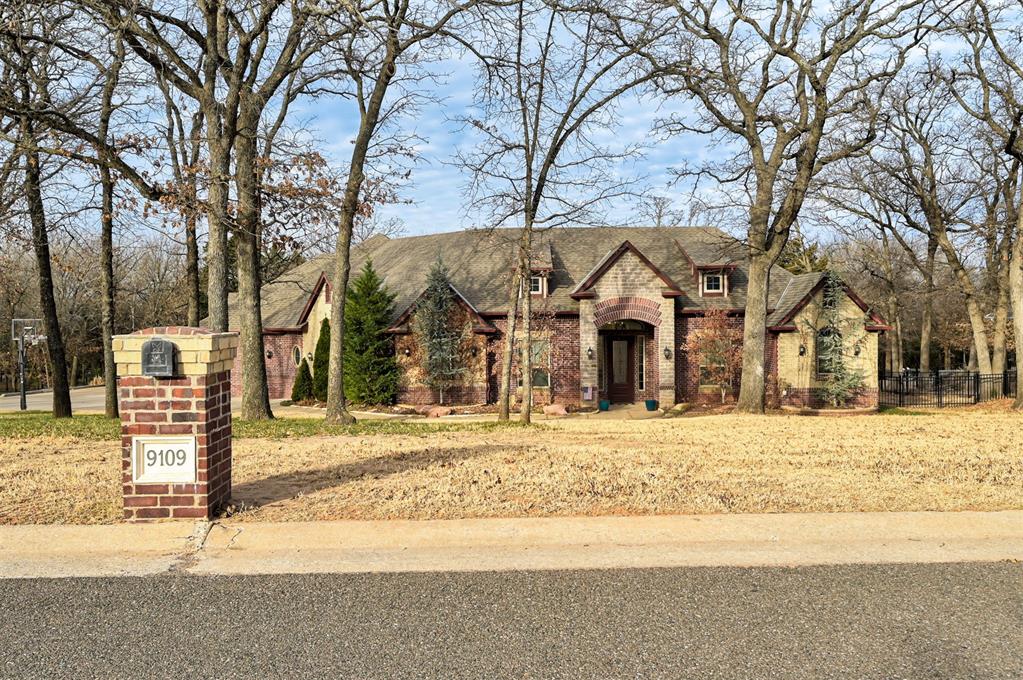 Nestled in the highly sought after Oakdale School District in northeast Oklahoma City, 9109 Via Del Vista offers a beautifully updated home on a spacious, tree-lined lot with convenient access to I-35—providing quick connectivity to downtown Oklahoma City, Edmond, Tinker AFB, and the entire metro. Extensively improved in 2020, this custom designed floor plan has it all. The home showcases refinished wood flooring throughout the main living areas and new wood flooring in the kitchen for a seamless, elevated look. The remodeled kitchen serves as the heart of the home with updated stylish backsplash, and a new center island designed for gathering and entertaining. All three full bathrooms have been thoughtfully renovated. The ensuite full bath was completely remodeled, and the Jack-and-Jill bath features new tile flooring, countertops, backsplash, and refreshed shower and tub finishes. The primary bath has been updated with painted cabinetry, a new tub, and designer tile accents. The  primary bath offers separate vanities, a flex space that could be used as a dressing room, nursery or workout area and separate his and her restrooms and closets, a genius design feature not found in many homes! Fresh paint throughout the entire home creates a crisp, move-in-ready presentation. Additional interior upgrades include carpet in the rec/play room and updated bamboo blinds and curtains in the main living areas and primary bedroom. Outdoors, the 1+ acre wooded property truly shines with front and back rod iron fencing, a huge covered patio for entertaining or relaxing and professional landscaping. With extensive updates, thoughtful improvements, and exceptional access to the metro, this move-in-ready property offers both comfort and convenience in a highly accessible northeast OKC location. Come and see it and make it your own!