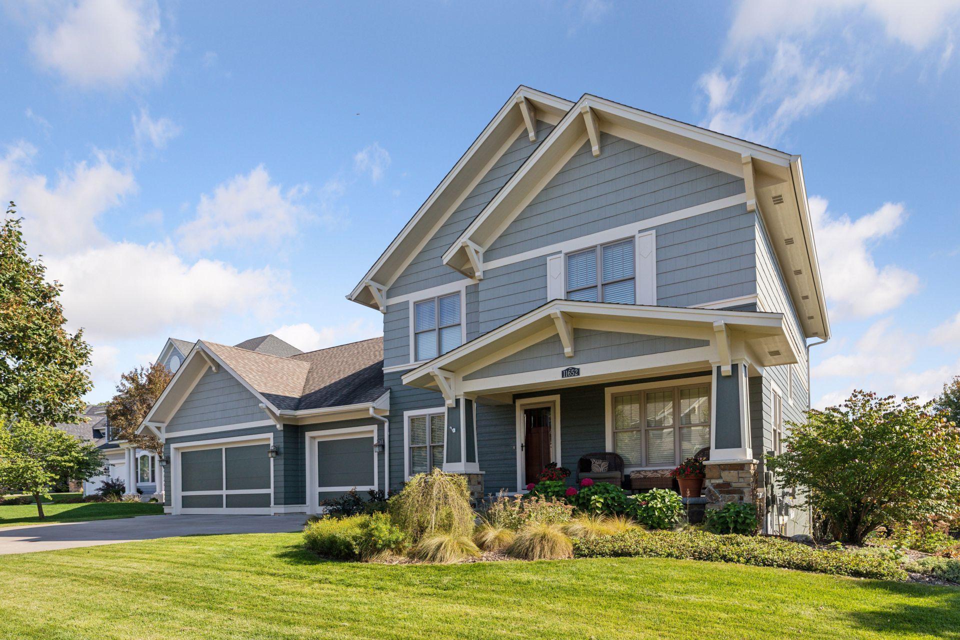 Sensational Derrick custom home perfectly nestled on a quiet cul-de-sac and situated on an oversized premium walkout lot on the most coveted streets in Stonemill Farms. Surrounded by mature trees and lush landscaping, this residence offers both privacy and a sense of community with access to Stonemill’s premier amenities.

As you step inside, you’ll be welcomed by beautiful wood floors, upgraded enamel casing and cabinets, and an open floor plan that flows seamlessly, creating a warm and inviting atmosphere. The great room showcases a fireplace framed by custom built-in cabinets, while the gourmet kitchen is a chef’s delight—complete with wood-paneled built-in appliances, a large stainless steel gas range and oversized oven, granite countertops, walk-in pantry, and a built-in hutch at the butler’s pantry. The main floor also provides a formal dining room and a separate office or flex room while the  resource room features a built-in desk and cabinetry, is ideal for homework or a second office.

Everyday functionality is unmatched with a spacious mudroom that includes a walk-in closet, custom bench, shoe storage, and hooks to keep everything organized. Upstairs, the primary suite is a retreat with a spa-like bathroom featuring an oversized marble-detailed shower, granite vanity, and an enormous walk-in closet. The second bedroom is a private en-suite, while bedrooms three and four share a convenient Jack-and-Jill bathroom. The upper-level laundry adds ease to daily living.

The walkout lower level is an entertainer’s dream, boasting a stone fireplace and media area, wet bar with custom built-in cabinets and full-sized stainless-steel refrigerator, a large flex space that can serve as a workout, toy, or billiard room, a fifth bedroom, and a full bathroom with custom tile and granite countertops

Step outside to discover your own backyard paradise with a maintenance-free deck, perennial gardens, patio, a firepit for cozy evenings, and mature trees that enhance the setting. Car enthusiasts will appreciate the enormous, heated oversized garage—968 sq. ft. and up to 34 feet deep on the 2-stall side—perfect for multiple vehicles, boats, or recreational toys.

From a technology standpoint, enjoy:  a six-zone Sonos system with integrated speakers, a whole-house security system, dual zone HVAC with whole house humidifier, owned water softener and RO system, irrigation system.  New hot water heater in 2022. New Roof (2025)

Community amenities abound with a large pool and changing room, ice rink, fitness facility, community room, multiple parks, trails, and more. Served by Liberty Ridge Elementary, Lake Middle School, and East Ridge High School, this home is not only a showcase of craftsmanship but also perfectly positioned in one of Woodbury’s most desirable neighborhoods.

Truly a must-see property that defines Stonemill luxury living!