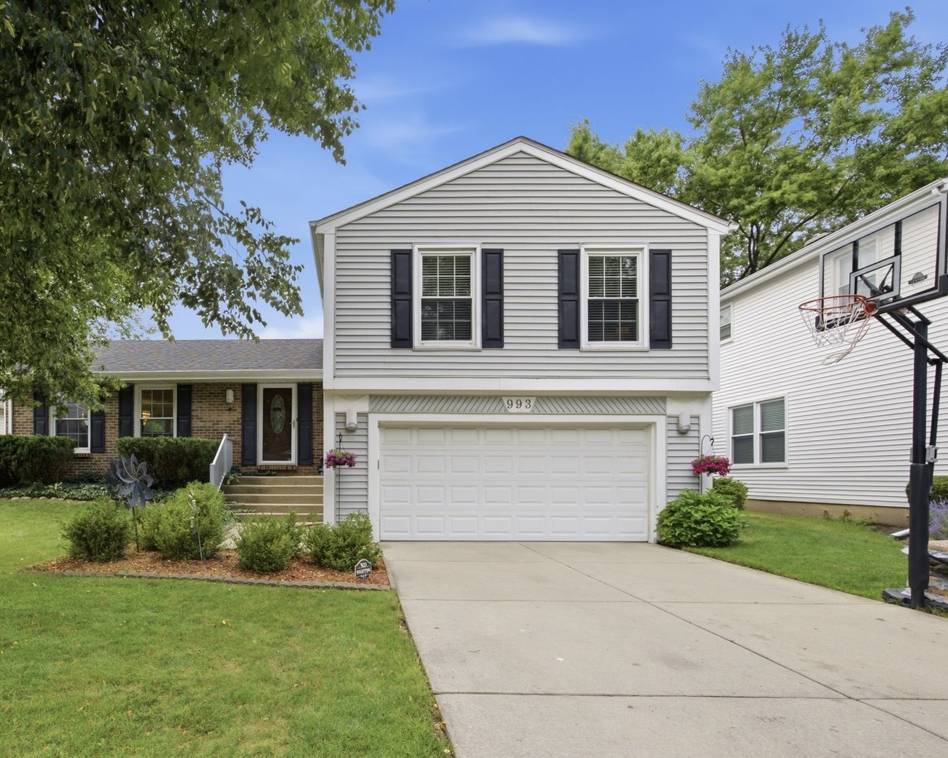 Welcome Home! - a rare gem in an unbeatable location!  This beautifully maintained, move-in-ready home is nestled on one of Strathmore's rarely available private streets and offers the perfect blend of comfort, space, and convenience. Located within walking distance of Prairie Elementary, just ~2 mile from Twin Groves Middle School, and only 2.5 miles from highly acclaimed Stevenson High School. Enjoy everything you need just minutes from your doorstep. Libraries, parks, shopping, restaurants, childcare, hospitals, major highways, and Metra stations are all within a 10-minute drive, making everyday life incredibly convenient.      Step inside to a bright and spacious living room and formal dining room, perfect for hosting holiday gatherings and entertaining family and friends. The oversized kitchen-the largest in the subdivision-is truly a chef's dream, offering abundant workspace and storage. The adjoining breakfast area overlooks a beautifully designed patio, creating the perfect setting for morning coffee, outdoor dining, or relaxing year-round. A row of mature arborvitae provides exceptional privacy and a picturesque backyard retreat. A convenient powder room completes the main level.    Upstairs, the spacious primary suite features a walk-in closet and a private ensuite bath complete with a Jacuzzi tub. Three additional generously sized bedrooms share a full hallway bathroom, providing plenty of room for family and guests. The expansive lower-level family room offers versatile living space, ideal for movie nights, a game room, home office, or play area. This home has been lovingly cared for and thoughtfully updated throughout. Be sure to review the extensive list of recent improvements including gleaming Brazilian cherry hardwood floor throughout, newer roof/appliances, electric vehicle charger, and many more. Don't miss this rare opportunity to own a beautiful home in one of Strathmore's most desirable locations. Move in, settle down, and start creating memories that will last a lifetime!