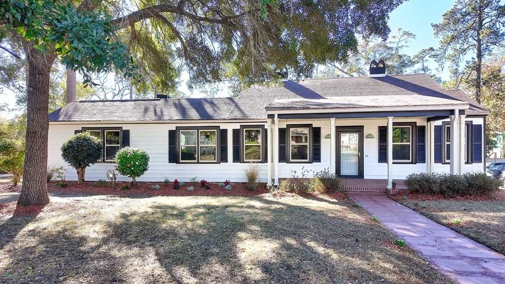 Updated Vintage Home With Income Producing Garage Apartment, One Block From Park and Schools, and just a few blocks from Downtown Thomasville, Georgia. If you have been dreaming of a home where you can truly enjoy everyday life, this beautifully updated property offers comfort, charm, and convenience in one smart package. Located just a few steps to the city park and schools and a few blocks from downtown Thomasville, this home makes walkability a lifestyle. Sidewalks lead all the way downtown, and the property is just a short golf cart ride to football games, shopping, restaurants, and local festivities.  Step inside the main house and you will immediately notice the refinished hardwood floors, sealed with three coats for durability, along with fresh interior and exterior paint completed in 2025. The family room is warm and inviting with tongue and groove pine paneling on both the walls and ceilings. Two fireplaces, insulated chimneys, and modernized bathrooms allow this home to maintain its classic character while offering the updates today's buyers appreciate.  The kitchen has been fully refreshed and is ready for everyday living, featuring newly painted cabinets, countertops, appliances, and luxury vinyl flooring for a clean and stylish finish. A new refrigerator and dishwasher were installed in 2019, and a new heat pump added in 2021 provides year round comfort.  One of the standout features of this property is the garage apartment, currently occupied through Summer 2026, offering an excellent income producing opportunity to help offset your mortgage. The apartment has been thoughtfully updated with new luxury vinyl plank flooring, a brand new staircase, fresh paint, updated shower plumbing, a new refrigerator, and a new garbage disposal, all completed in 2025. Beneath the apartment is a three bay garage, perfect for vehicles, storage, or a workshop. An added bonus is the corner lot, which allows for two separate driveways; one on Glenwood and one on Palmetto Drive.  Additional major updates include double insulated windows throughout both the home and apartment, upgraded electrical, and a roof replaced in mid 2017 with a 25 year roof. Exterior improvements include new landscaping, a freshly painted front patio and sidewalk in 2025, along with a newly installed rock driveway and dedicated parking space for the apartment tenant, also completed in 2025.  This property offers the perfect balance of a comfortable primary residence and a built in income stream, all in a location that keeps you close to everything Thomasville has to offer.