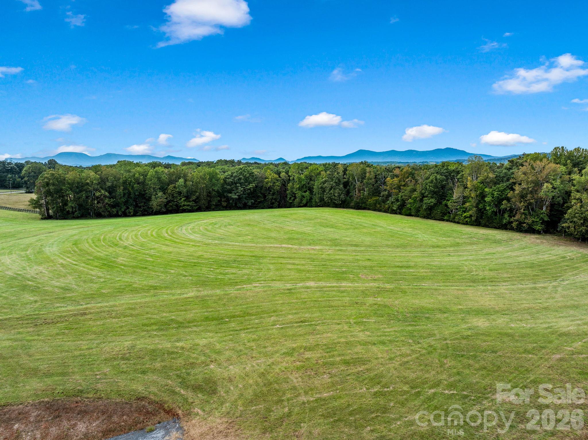 Collinsville Meadows offers 87.83± acres of rolling pasture, mature hardwoods and Hughes Creek in the heart of Polk County’s Hunt Country. Set along Collinsville Road, established pastures provide room for your homesite, barn and fencing, while hardwoods lining Hughes Creek add privacy and space to explore.Direct access to the CETA trail system connects you to the surrounding horse country, with Tryon International Equestrian Center, FENCE and Harmon Field just minutes away. Greenville, Asheville and Charlotte airports offer convenient travel options.An exceptional setting for a private equestrian estate, with the acreage and character to become a legacy property for generations.