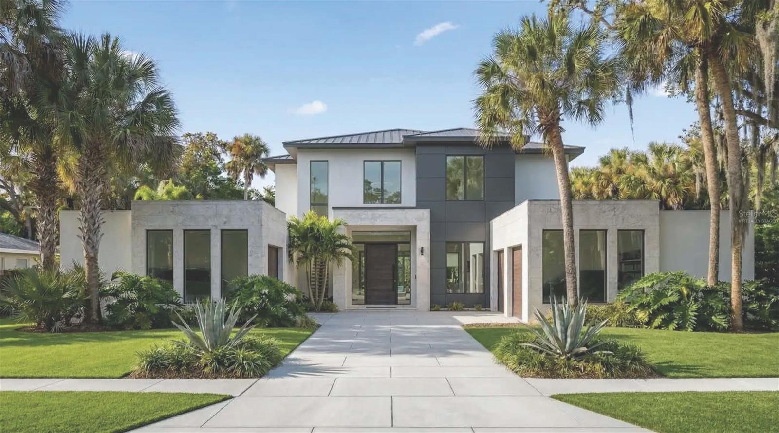 One or more photo(s) has been virtually staged. Under Construction. Being expertly built by Mrcela Custom Homes, this estate represents the pinnacle of modern luxury within the gates of Lake Nona Golf & Country Club. Thoughtfully designed for elevated family living and effortless entertaining, the residence spans more than 6,000 square feet under air and includes six bedrooms and six-full and-one-half baths, highlighted by a private guest casita with its own kitchen and living area. Additional features include a state-of-the-art theater, dedicated office, and upstairs family lounge. The grand primary suite offers a spa-inspired bath and custom dressing room, while the chef’s kitchen showcases premium appliances and a walk-in butler’s kitchenette. Expansive open-concept living spaces with floor-to-ceiling glass connect seamlessly to an enclosed lanai overlooking a resort-style backyard with pool, spa, and summer kitchen. With three-car garage spaces, the single garage includes the option to convert its one bay into a custom flex space—ideal for a studio, wellness retreat, or entertainment area. Offering superb amenities, exceptional family experiences and outstanding service, Lake Nona Golf & Country Club has delivered the highest quality of living in Central Florida for more than 30 years.