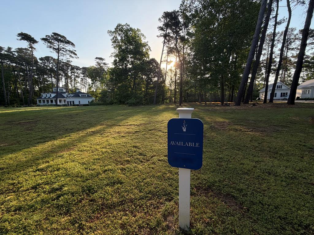 LARGE HOMESITE IN HERON POINTE! Don't miss this rare opportunity to own one of the most desirable homesites in Bay Creek's prestigious Heron Pointe neighborhood. Spanning over half an acre, this exceptional property backs to a peaceful creek and is beautifully framed by golf course views on both sides. Located directly across from Arnold Palmer's Signature Hole #3—one of his favorite Chesapeake Bay designs—this homesite offers the perfect setting to build your dream coastal retreat. Enjoy quick golf cart access to Bay Creek's outstanding amenities, including a 2-mile private beach, pools, fitness center, nature preserve, and more. Just minutes from Cape Charles' Historic District with restaurants, boutique shopping, marinas, and small-town charm. No required timeframe to build, plus Bay Creek's Builders Guild helps guide the process and makes creating your custom home simple and seamless. Walk this incredible homesite today and experience the beauty, privacy, and lifestyle Bay Creek has to offer!