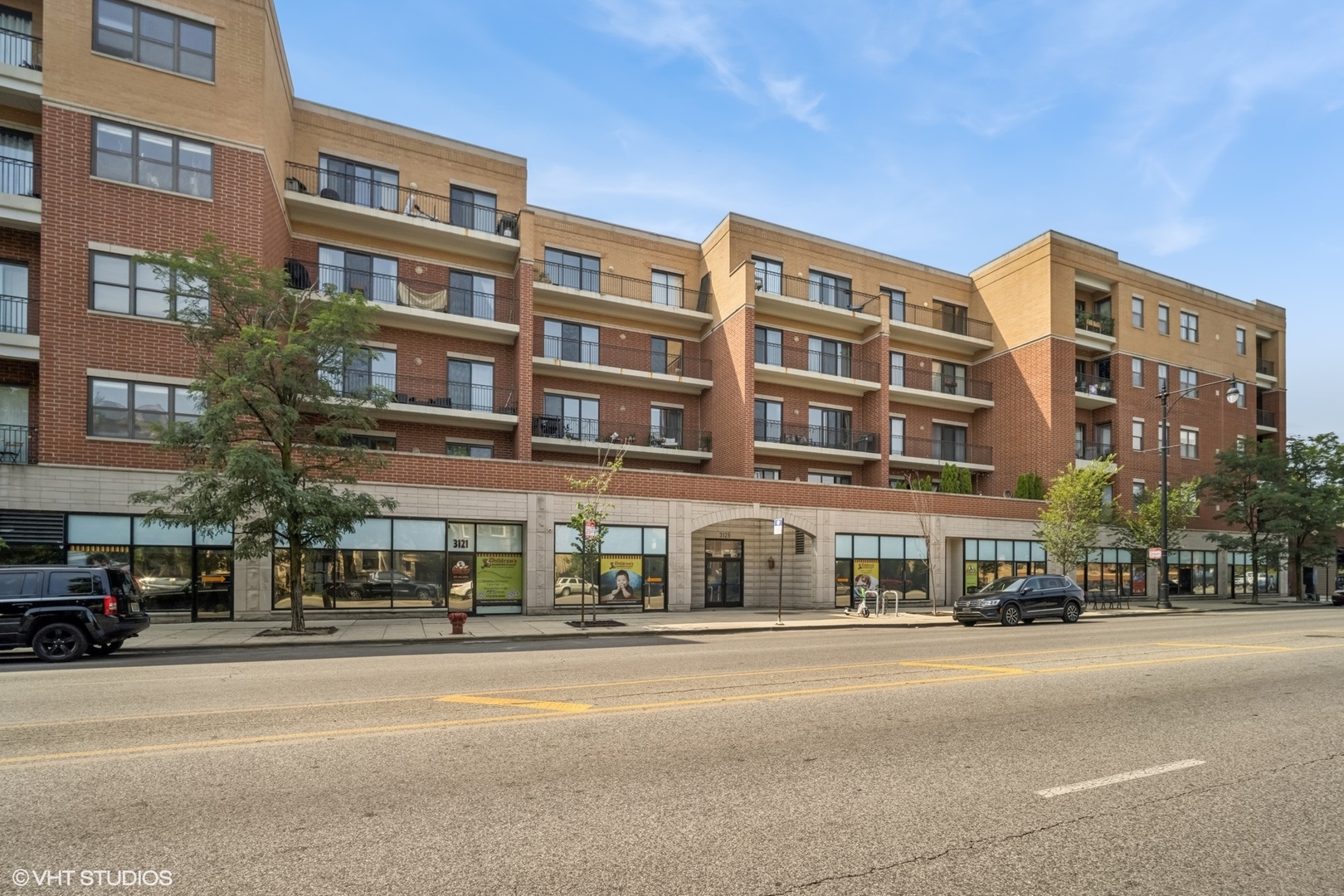 Some homes simply hold your things while others hold future memories and the promise of good things to come. Welcome to this incredible top floor, two-bedroom, two-bath condo in the vibrant heart of Logan Square, where natural light pours through large picture windows and the rhythm of the city lingers just beyond your private balcony.  Facing south, this unit is bright by day, and quietly glowing by night. The open layout shows off space that feels both inviting and intentional. At the center is a modern kitchen that blends form and function featuring stainless steel appliances, a striking tile backsplash, and a generous island ready for slow breakfasts, spontaneous gatherings, or late-night conversations.  The primary suite offers more than just comfort, it offers calm. With two roomy closets and a spa-like en-suite bath featuring double vanity, a soaking tub and walk-in shower, it's a space that invites you to slow down and stay awhile.  The second bedroom sits across from the recently remodeled guest bath and features a striking accent wall and double wide closets. And then there's the balcony, an outdoor living space that feels like an escape in the middle of it all. Think quiet dinners under string lights, lazy Sunday mornings with coffee and sun, or hosting friends with Chicago's beautiful skyline off in the distance.  Other amenities include In-unit laundry, heated garage parking, secure bike room and a private storage locker in order to add ease to your everyday. Plus, this boutique elevator building also features a fitness room and a rooftop deck with panoramic views that remind you why you chose this neighborhood. Located just two blocks from the Blue Line and surrounded by some of Logan Square's best, from tree-lined parks to the famers market, the 606, great dining and more. This isn't just a condo, it's your next chapter; and it begins here; don't miss it!