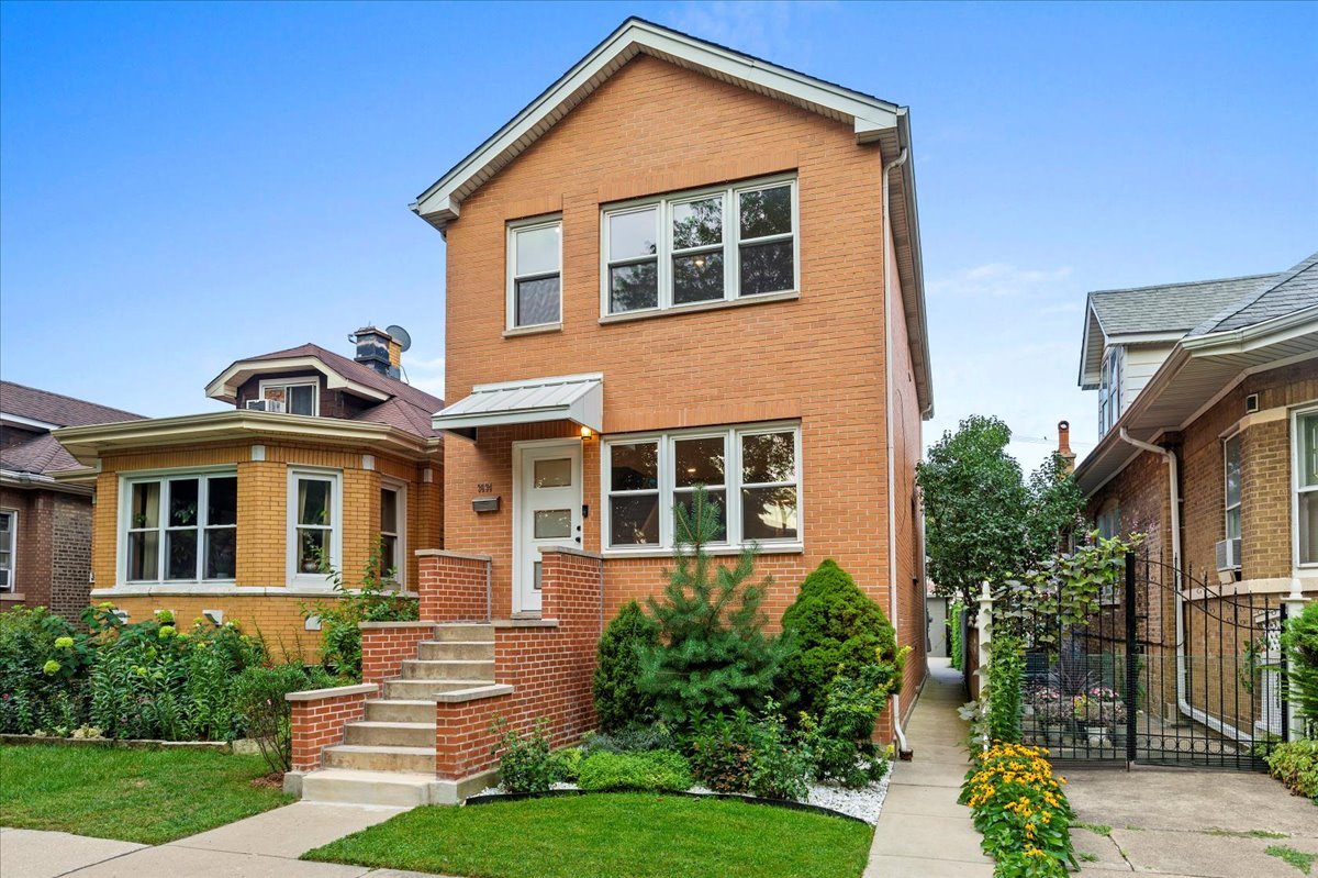 Avondale Beauty - Completely Reimagined!  This all-brick home on quiet, tree-lined Mozart Street has been transformed from top to bottom, blending modern comfort with timeless quality. Step inside to find spacious rooms with gleaming hardwood floors, a brand-new kitchen, and fully renovated bathrooms-all finished with style and attention to detail. Every aspect has been refreshed: new windows, doors, and a rehabbed, extra long, two-car garage ensure truly worry-free living. The sun-filled kitchen opens to a Trex deck (with a 35-year warranty) overlooking a private backyard-ideal for outdoor entertaining. A finished basement provides extra living space, while a 10-year-old roof adds long-term peace of mind. Perfectly move-in ready, this home offers energy-efficient upgrades throughout. Just steps from California parks, the Riverwalk, top-rated schools, and city conveniences-this is the turnkey home you've been waiting for!