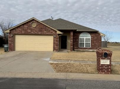 **Spacious Edmond Rental | 3 Bedrooms | 2 Baths | 2 Living Areas**Enjoy space, comfort, and flexibility in this well-maintained 1,835 sq. ft. Edmond home! Featuring **two separate living areas and new hard-surface flooring throughout**, this home offers a versatile floor plan with plenty of room for everyday living and entertaining.The spacious kitchen includes a convenient pantry, while the inviting living area features a cozy gas fireplace. The generously sized primary suite offers a charming bay window, two closets, and a private bath with double vanities, a separate soaking tub, and a walk-in shower.Step outside to a **large backyard backing to open space with no immediate rear neighbors**, providing added privacy and room to enjoy the outdoors. A 10 × 10 storage shed offers additional storage, while the attached two-car garage adds everyday convenience.Ideally located near Penn and Covell in Edmond, with convenient access to shopping, dining, neighborhood walking paths, and area amenities.**Two living areas, updated flooring, a spacious primary suite, and a backyard with added privacy make this home a standout rental opportunity. Schedule your showing today!**