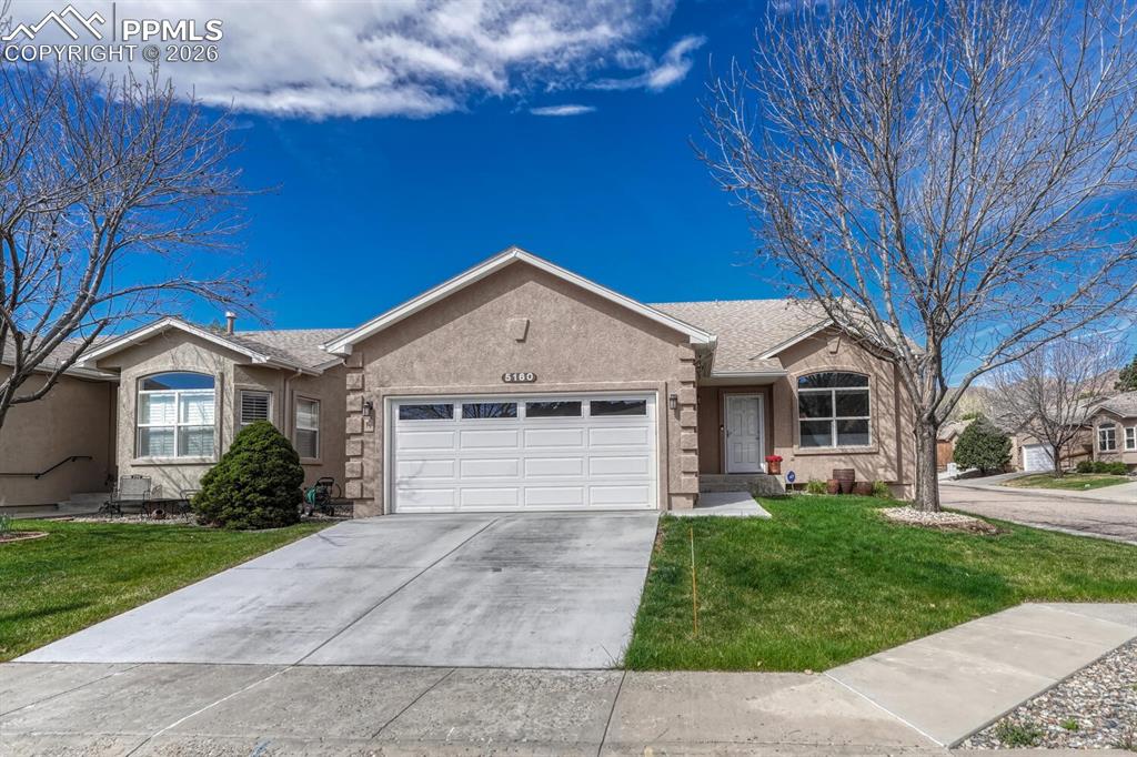 Low maintenance main level living in Northwest Colorado Springs at Pinon Glen! This patio home offers a great layout packed with upgrades! Hickory wood floor runs throughout the main level, with high vaulted ceiling in living room and unique rock formation views from front windows. Kitchen features white cabinets, granite counters, tile backsplash, stainless steel appliances (2023), island, pantry, and breakfast nook. Graced with tile surround and built-in shelves, double-sided gas fireplace serves living and dining rooms. Enjoy easy indoor-outdoor dining with walk out to deck. Main level primary bedroom offers wood floor, walk-in closet, and attached five-piece bathroom with dual vanity, granite counter, and updated lighting and fixtures. Main level includes powder room and laundry room with newer washer and dryer (2023)! Sunny loft overlooking living room features mountain views, vaulted ceiling, and closet, making it totally versatile as a second living room, office, playroom, or fourth bedroom. Two bedrooms, full bath, and storage closet complete upper level. All new carpet! Full unfinished basement gives storage space and room to grow. Composite deck is private space for gardening, entertaining, and relaxing. You’ll love the mechanical awning to add shade when you need it and retract when you don’t. Community walking path behind the home runs among mature trees and green grass. More perks include custom window treatments, central A/C, humidifier, hail resistant Class IV roof, and new driveway, walkway, and exterior paint. Visit nearby Pinon Valley Open Space, Ute Valley Park, and Popes Bluff anytime! Locally loved Blodgett Open Space, internationally acclaimed Garden of the Gods, and I-25 are convenient too! Rent Pinon Glen clubhouse to host meetings, gatherings, and events. Self-managed HOA upkeeps landscaping, provides exterior building maintenance, and shovels snow including driveway and walkway to front door. Say yes to this great house and great community!