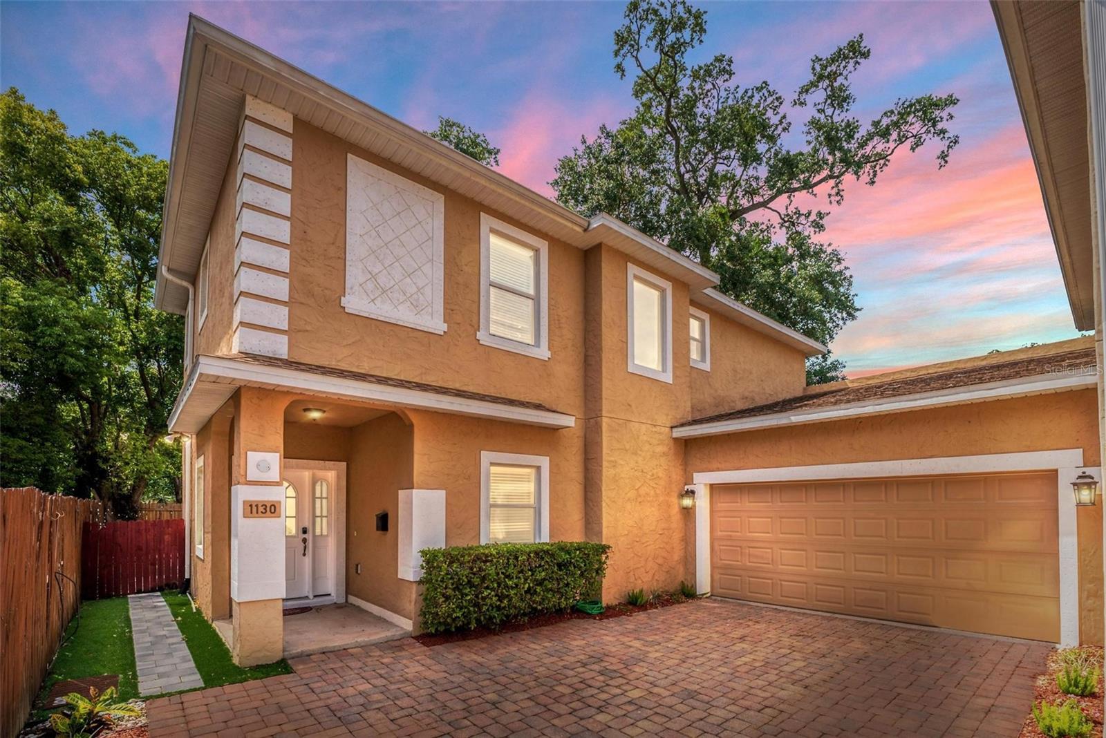 Stylish Colonialtown Home with Modern Upgrades and No HOA!Welcome to this beautifully updated 4-bedroom, 2.5-bathroom home nestled in the heart of Colonialtown North—a vibrant, walkable neighborhood known for its tree-lined streets, charming bungalows, and strong sense of community. Just minutes from downtown Orlando and Winter Park, this prime location offers the best of both worlds: quiet residential living with all the excitement of the city just around the corner.With no HOA and move-in-ready convenience, this two-story home combines classic curb appeal with contemporary comfort. A brick-paved driveway leads to a spacious 2-car garage, while inside, soaring ceilings and expansive windows fill the semi-open layout with natural light. Luxury vinyl plank flooring flows throughout the first floor, tying together the inviting living room and adjoining dining space—ideal for family dinners or hosting friends.The kitchen is a showstopper, designed for both style and functionality. You'll love the quartz countertops, stainless steel appliances, Shaker cabinetry, and oversized center island that serves as a breakfast bar and gathering hub. Just off the kitchen, the family room provides a peaceful view of the private backyard.Also on the main floor, you’ll find a convenient powder bath and a laundry room with extra storage. Upstairs, the generous primary suite features a walk-in closet and a spa-inspired bathroom with dual vanities and a sleek glass-enclosed shower. Three additional bedrooms give flexibility for family, guests, or a home office setup.Step outside into your own backyard retreat—complete with low-maintenance turf, paver patio, lush landscaping, and a charming Pergola perfect for outdoor dining or relaxing year-round.Living in Colonialtown North means you're just a short walk or bike ride from popular local favorites like Rooster Taqueria, Bikes Beans & Bordeaux, and East End Market. Nearby Leu Gardens, Mills 50, and the Audubon Park Garden District give a mix of culture, nature, and creativity. With quick access to cultural venues, parks, dining, shopping, and major roadways, this home truly delivers the best of urban living in one of Orlando’s most beloved neighborhoods.