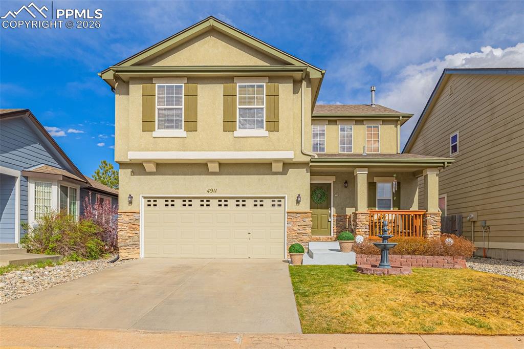 Welcome to one of the most stylish homes you'll see!  Ideally located in the desirable Powers Corridor with easy access to shopping, dining, and District 49 schools. This well-maintained home offers 3 bedrooms, 3 bathrooms, and over 2,000 square feet of thoughtfully designed living space.The inviting exterior features stucco facing, a charming front porch, and manicured landscaping with a peaceful water feature. The backyard provides a private, low-maintenance retreat with turf, composite decking, and a custom retaining wall—perfect for relaxing or entertaining.Inside, the main level showcases durable luxury plank flooring throughout and a bright, open living room with soaring ceilings, abundant natural light, and a gas fireplace with tile surround. The space flows seamlessly into the dining area with walk-out access to the backyard. The updated kitchen features quartz countertops, tile backsplash, stainless steel appliances, ample cabinetry, and a pantry. A convenient powder room completes the main level.Upstairs, the spacious primary suite includes a walk-in closet and private bath with double vanities. Two additional bedrooms offer great space and Pikes Peak views, along with a full secondary bathroom.The fully finished basement is ideal for entertaining, featuring a custom media wall, flexible living space, additional storage, and a combined laundry and half bath.