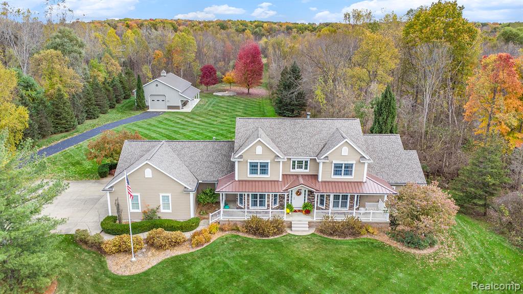 Great opportunity to own this incredible home nestled on over 24 private acres in Attica. Meticulously maintained with exceptional attention to detail, this property offers both comfort and seclusion. A 400-foot asphalt driveway leads to the home’s peaceful, private setting. The home features nearly 5,000 square feet of finished living space. The main floor includes a spacious great room with beamed ceilings and a stunning stone fireplace. The beautiful kitchen offers abundant oak cabinetry, ample counter space, an island, newer appliances, and a cozy breakfast nook. A formal dining room with a bay window and hardwood floors provides the perfect space for entertaining. The main-floor primary suite features tray ceilings, two walk-in closets, and a luxurious en-suite bath complete with a heated jetted tub and a separate walk-in shower with multiple shower heads. French doors open to a private office. The main level also includes a large laundry room and a separate mudroom off the attached garage. Upstairs, you’ll find two generously sized bedrooms, both with walk-in closets, and a full bath. The basement, finished in 2016 to match the quality of the main level, includes a kitchenette, two additional bedrooms, a full bath, and a workshop—ideal for guests, hobbies, or extended living space. Storage is plentiful with a three-car attached garage and a 36' x 45' Morton pole barn with tack roof. Major exterior updates include a new roof, siding, gutters, gutter leaf guards, and garage doors installed in 2020. Briggs and Stratton 20kW whole house generator system. The beautifully manicured yard features professional landscaping, low-voltage lighting, a 16-zone irrigation system, and a large paver bonfire pit. The acreage is mostly wooded with established trails and four hunting blinds. Deer and turkey are frequent visitors, making this property a true outdoor retreat.