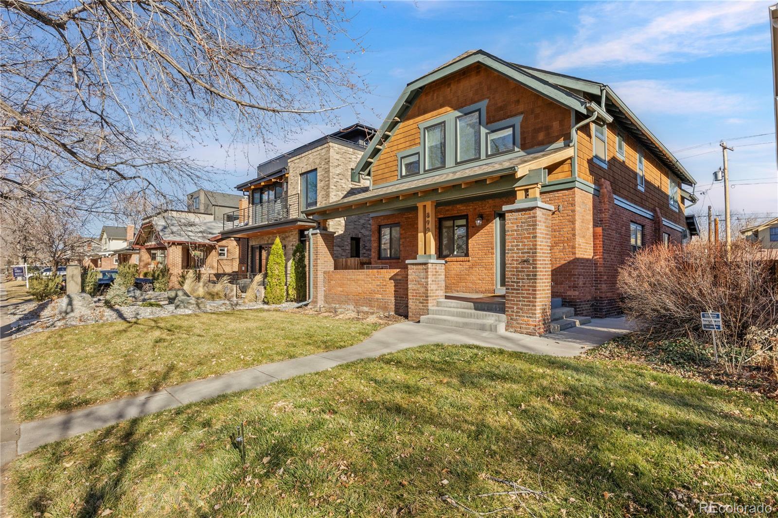 Beautiful home located just blocks from Washington Park, seamlessly blends classic character with modern sophistication in one of Denver’s most sought-after neighborhoods. Offering 5 bedrooms and 4 bathrooms, the home is designed for both effortless everyday living and refined entertaining. The open-concept main level centers around a striking chef’s kitchen with rich custom cabinetry, dramatic stone countertops, and an oversized island with bar seating, flowing naturally into an inviting living area anchored by a sleek fireplace. The adjacent dining space opens to a thoughtfully designed backyard patio, ideal for al fresco dinners and relaxed evenings beneath the glow of string lights.Upstairs, three spacious bedrooms include a light-filled primary retreat featuring vaulted ceilings, exposed beams, and a serene en suite bath. A dedicated main-level office provides an ideal work-from-home setup, while the finished basement adds versatility with two conforming bedrooms and a generous flex space perfect for a media room, gym, or guest suite. Framed by a timeless brick exterior, a covered front porch, and a private fenced yard, this East Wash Park home delivers exceptional style, function, and an unbeatable location.