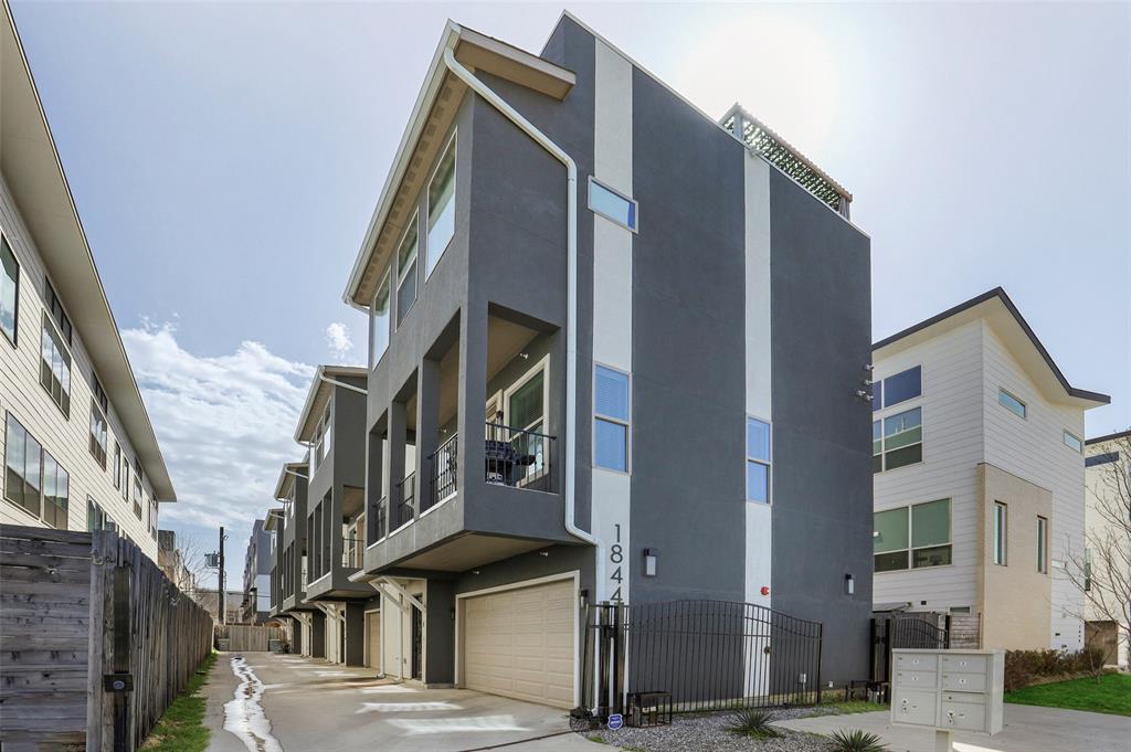 Live in the heart of it all - where modern design meets the vibrant energy of Lower Greenville and Henderson, just steps from Dallas’ best dining, nightlife, and boutiques. This sophisticated contemporary townhome offers effortless luxury across three levels, accessed by an IN-UNIT ELEVATOR, designed for both stylish entertaining and comfortable everyday living.The first floor welcomes guests with a private suite and full bath—perfect for visitors or a home office—along with access to a beautifully turfed backyard framed by a wood privacy fence. Upstairs, the light-filled second level showcases an open-concept living, dining, and kitchen space with clean lines and seamless flow. Step onto the balcony for evening grilling or unwind.The third floor offers the primary suite with large bathroom, another guest room or office with ensuite bath, and the laundry room. The fourth floor includes a storage loft and roof access to the expansive 500-square-foot rooftop deck, complete with a hot tub and sweeping city views.Thoughtfully curated upgrades elevate every detail & include high-end stainless steel appliances with gas cooktop, designer lighting, premium plumbing fixtures, hardwood floors, interior-exterior surround sound, security camera system, and a striking wrought iron front door. The rooftop features a sleek Skypaver system, adding both style and durability to your outdoor retreat.A rare blend of lock-and-leave convenience and luxury lifestyle—this home is truly a standout in one of Dallas’ most dynamic neighborhoods.