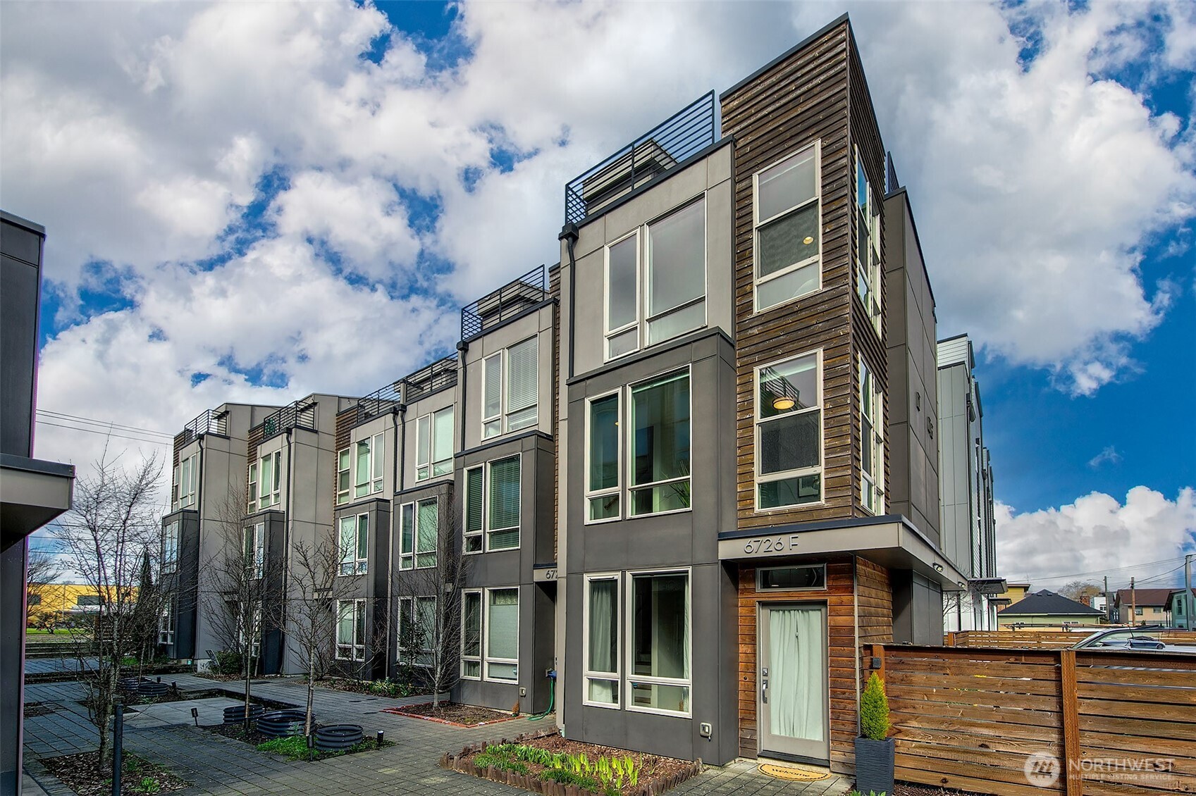 Welcome to vibrant Georgetown—home to iconic eateries, wineries, and easy freeway access. This meticulously maintained modern townhome offers 2 bedrooms + spacious den and 2 baths across a smart, open layout. The main level showcases a chef’s kitchen with quartz counters, large island, and stainless appliances flowing seamlessly into bright living and dining spaces. Just off the main living area, step into your private, fully fenced backyard—rare for a townhome—perfect for grilling, entertaining, gardening, or simply relaxing under the open sky.Upstairs features a generous bedroom, full bath, and versatile den ideal for an office or workout space. The top-floor primary suite is a peaceful retreat with access to a stunning rooftop deck boasting sweeping skyline views. This end unit offers additional windows, natural light, and spaciousness.  One dedicated parking spot, air conditioning, and no HOA complete this exceptional urban offering.